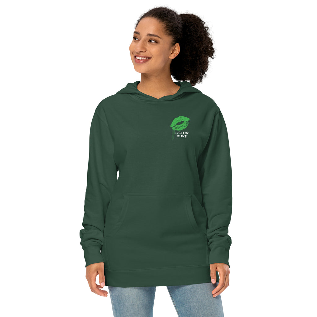 "Kiss Me I'm Irish" Anglerfish alpine green midweight hoodie on female model, front view, featuring a green dripping-lips "17TH & SURF" logo on the chest – 17th & Surf