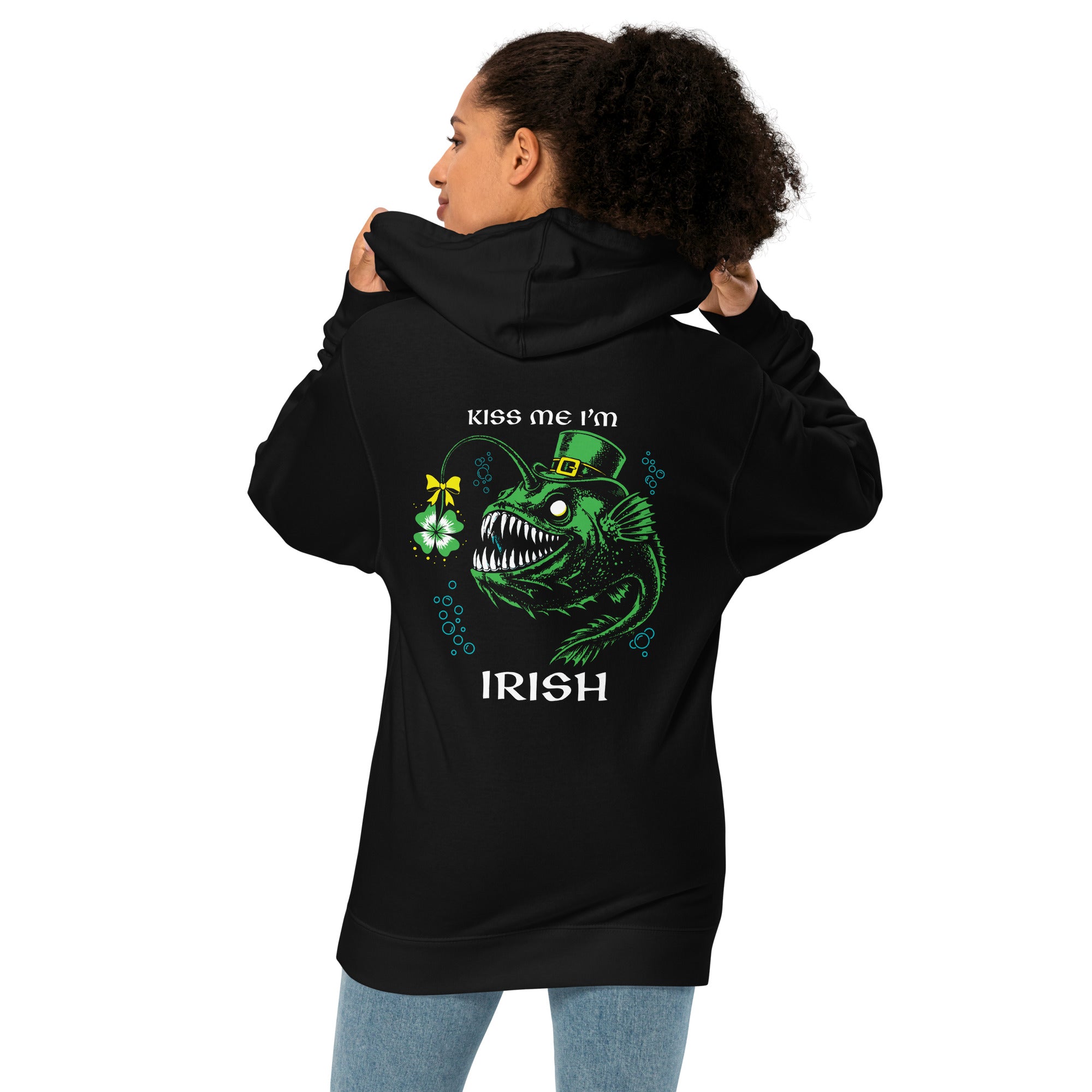 "Kiss Me I'm Irish" Anglerfish black midweight hoodie on female model, back view, featuring the green leprechaun anglerfish with shamrock lure and "KISS ME I'M IRISH" text – 17th & Surf
