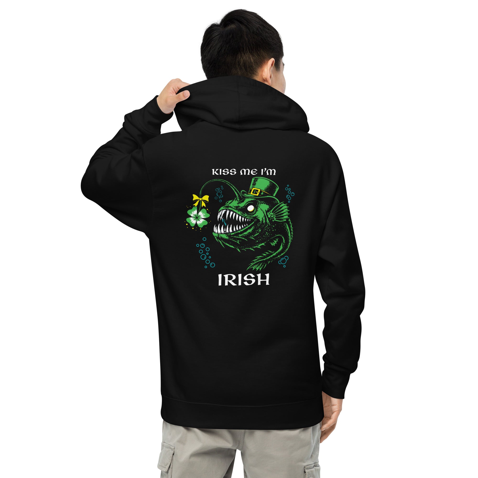 "Kiss Me I'm Irish" Anglerfish black midweight hoodie on male model, back view, featuring the green leprechaun anglerfish with shamrock lure and "KISS ME I'M IRISH" text – 17th & Surf