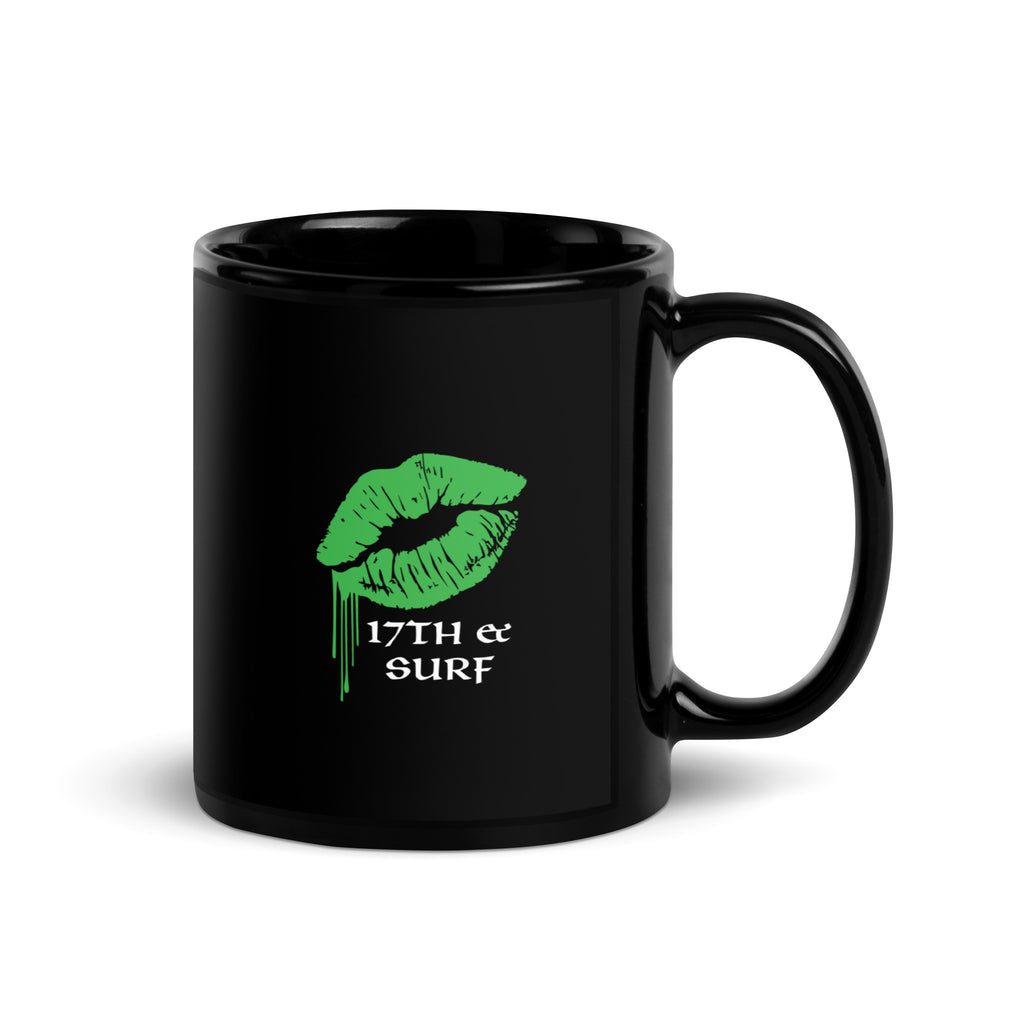 "Kiss Me I'm Irish" Anglerfish black glossy 11oz mug, handle on right, featuring the green dripping-lips "17TH & SURF" logo – 17th & Surf