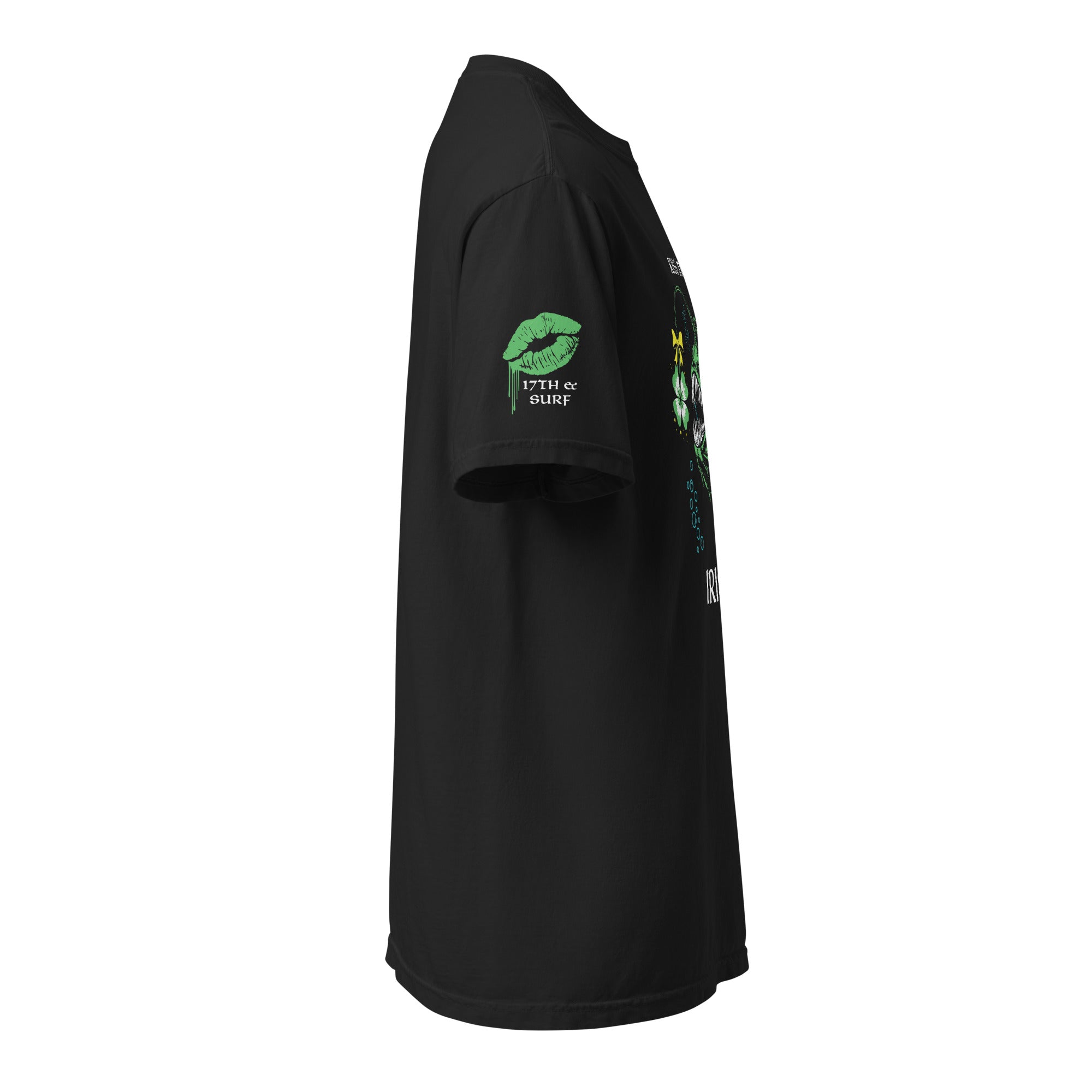 "Kiss Me I'm Irish" Anglerfish black tee, side profile flat lay highlighting the green dripping-lips "17TH & SURF" sleeve logo, with the anglerfish and shamrock design visible on the front – 17th & Surf