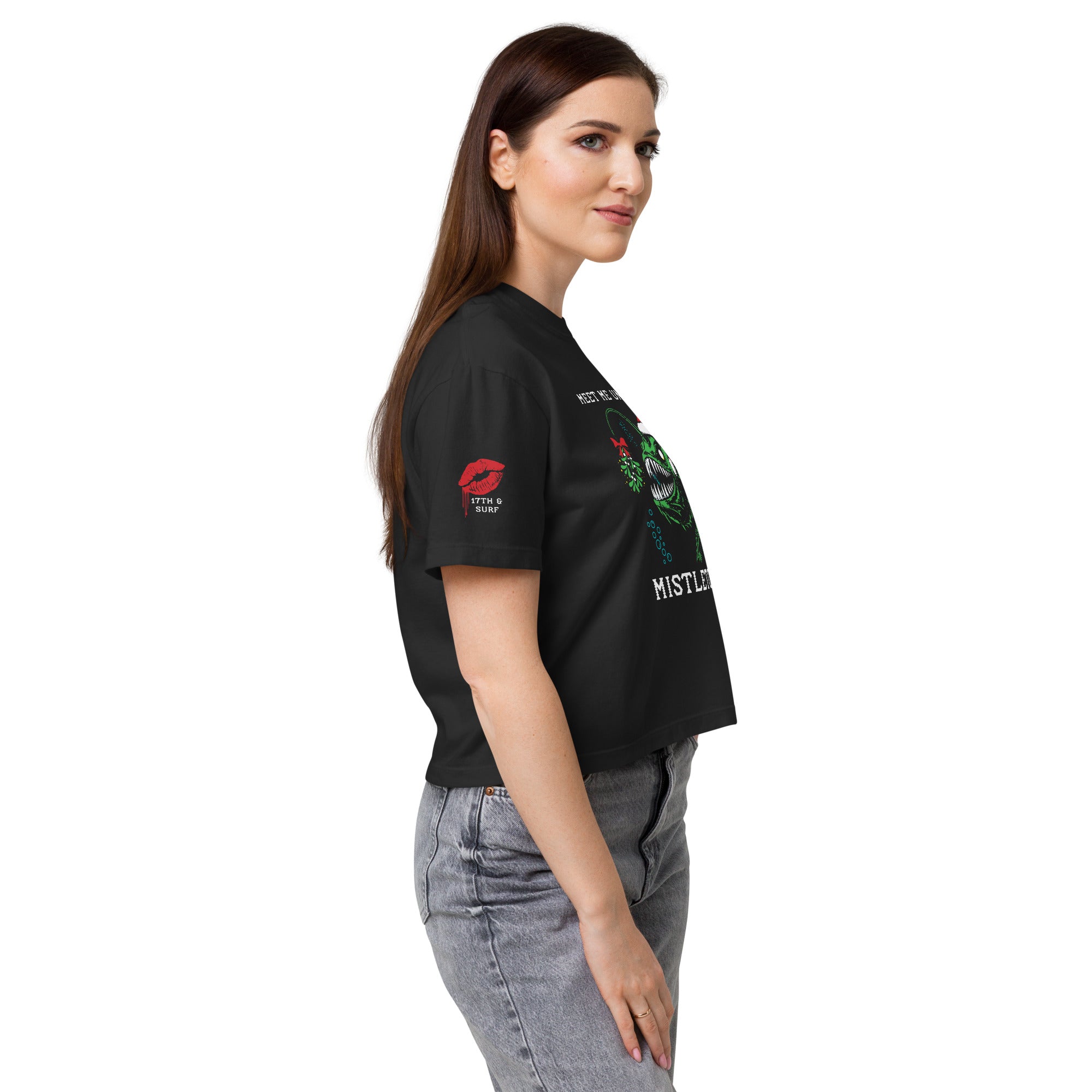 "Mistletoe" Anglerfish black heavyweight boxy t-shirt on female model, side profile, featuring the anglerfish Christmas graphic and dripping red lips sleeve logo – 17th & Surf