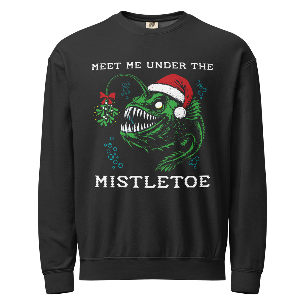 "Mistletoe" Anglerfish black lightweight fleece crewneck sweatshirt, front flat lay, featuring a green anglerfish wearing a Santa hat with a mistletoe lure and "Meet Me Under The Mistletoe" graphic – 17th & Surf