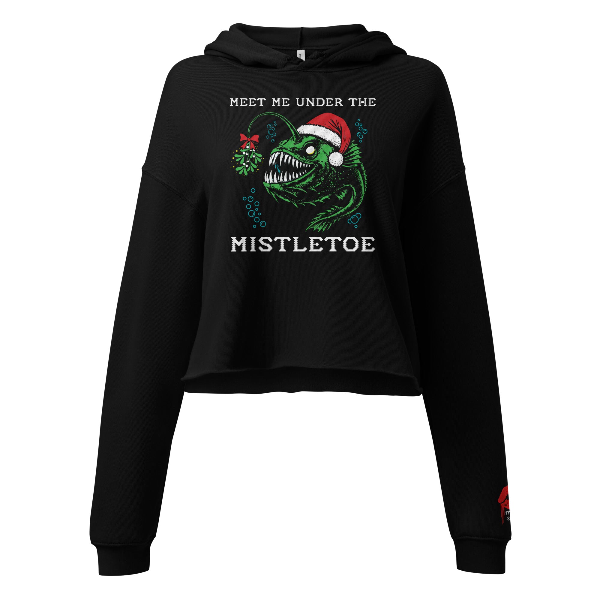 "Mistletoe" Anglerfish black cropped hoodie, front flat lay, featuring a green anglerfish wearing a Santa hat with a mistletoe lure, "Meet Me Under The Mistletoe" graphic, and dripping red lips "17th & Surf" sleeve cuff logo – 17th & Surf