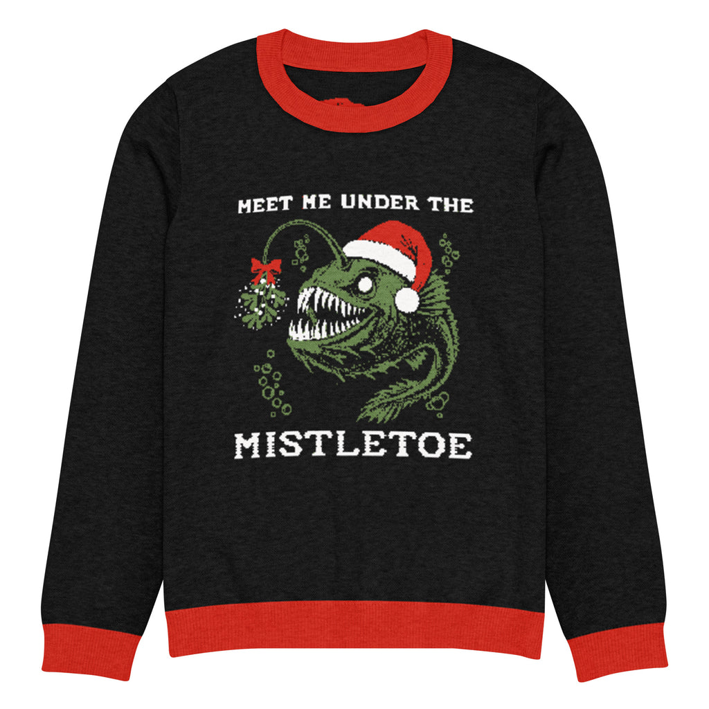 "Mistletoe" Anglerfish charcoal knitted Christmas sweater with red ribbed trim, front flat lay, featuring a green anglerfish wearing a Santa hat with a mistletoe lure and "Meet Me Under The Mistletoe" graphic – 17th & Surf