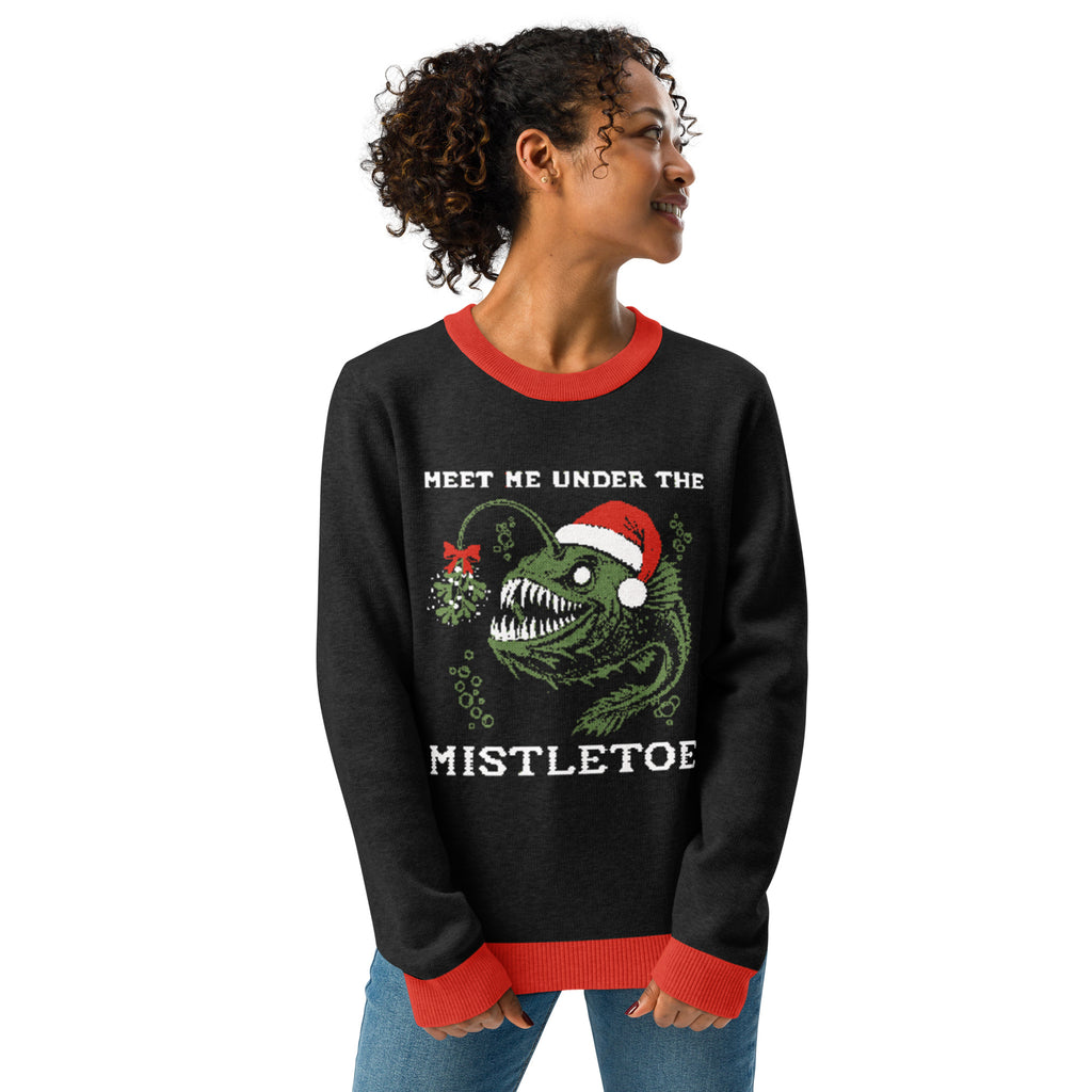 "Mistletoe" Anglerfish charcoal knitted Christmas sweater with red ribbed trim on female model, 3/4 angle front view, featuring the "Meet Me Under The Mistletoe" anglerfish graphic – 17th & Surf