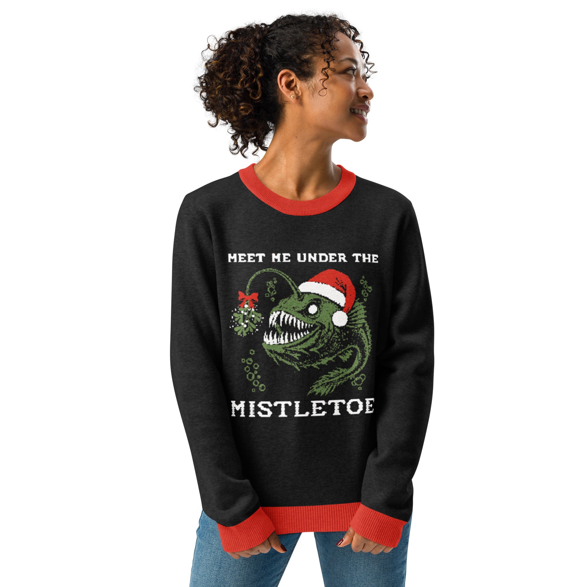"Mistletoe" Anglerfish charcoal knitted Christmas sweater with red ribbed trim on female model, 3/4 angle front view, featuring the "Meet Me Under The Mistletoe" anglerfish graphic – 17th & Surf