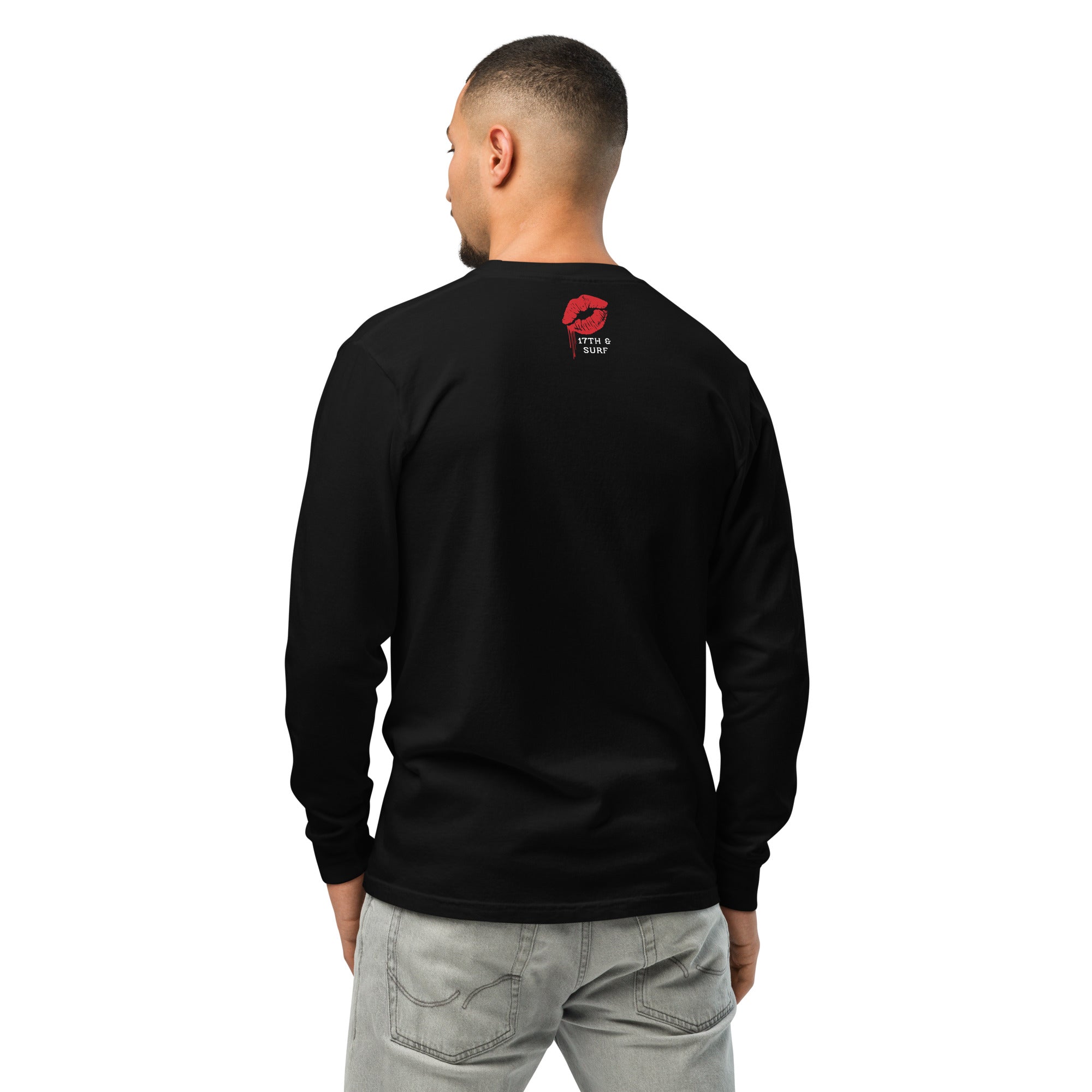 "Mistletoe" Anglerfish black heavyweight long sleeve shirt on male model, back view, featuring the dripping red lips "17th & Surf" collar logo – 17th & Surf
