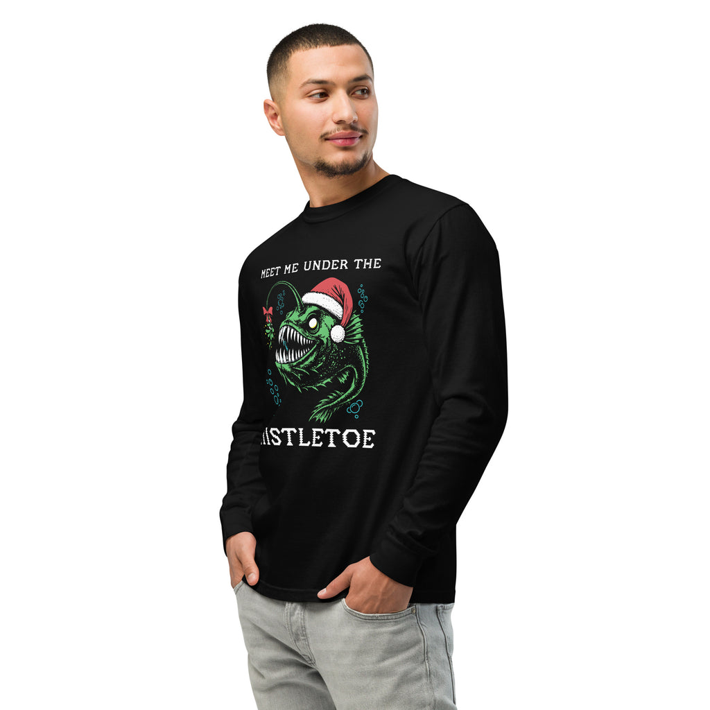 "Mistletoe" Anglerfish black heavyweight long sleeve shirt on male model, 3/4 angle front view, featuring a green anglerfish wearing a Santa hat with mistletoe and "Meet Me Under The Mistletoe" graphic – 17th & Surf