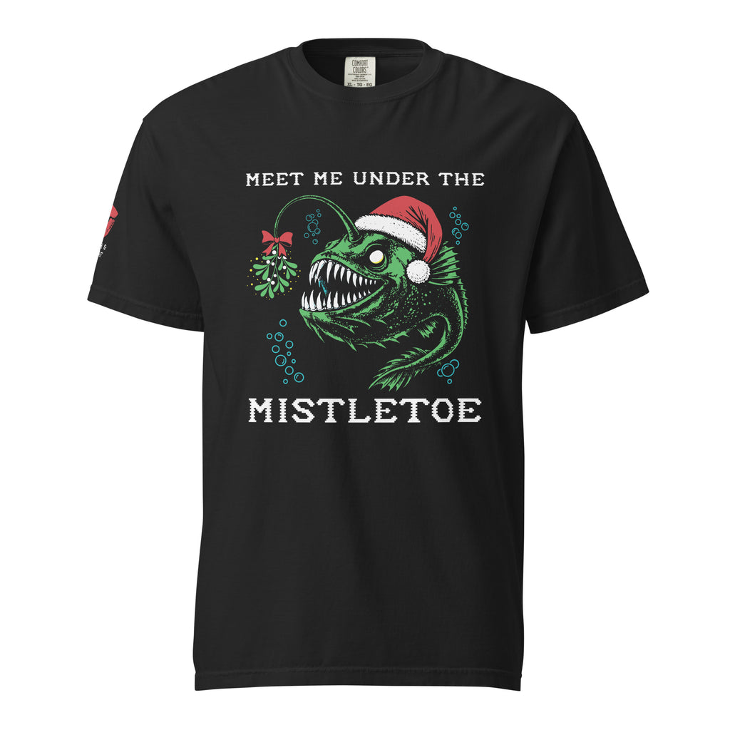 "Mistletoe" Anglerfish black heavyweight t-shirt, front flat lay, featuring a green anglerfish wearing a Santa hat with a mistletoe lure and "Meet Me Under The Mistletoe" graphic – 17th & Surf