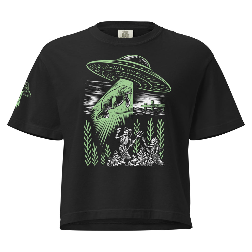 "Ocean Abduction" women's heavyweight boxy tee, flat lay front, featuring UFO abducting a manatee via tractor beam over skeleton mermaids design – 17th & Surf
