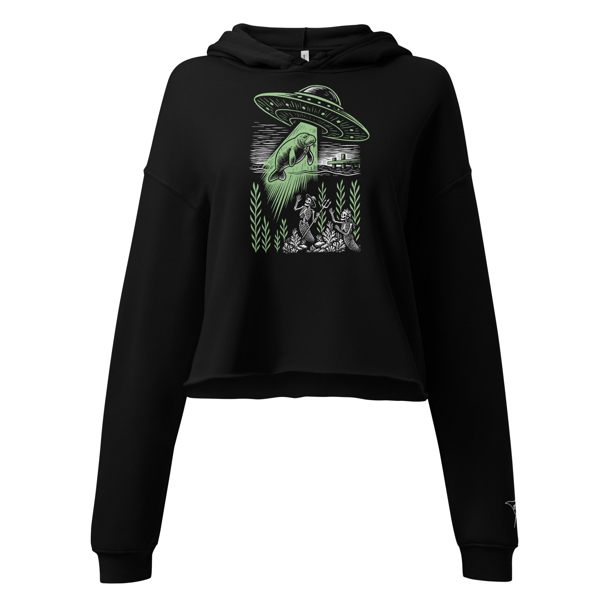 "Ocean Abduction" women's cropped hoodie, flat lay front, featuring UFO abducting a manatee via tractor beam over skeleton mermaids design – 17th & Surf