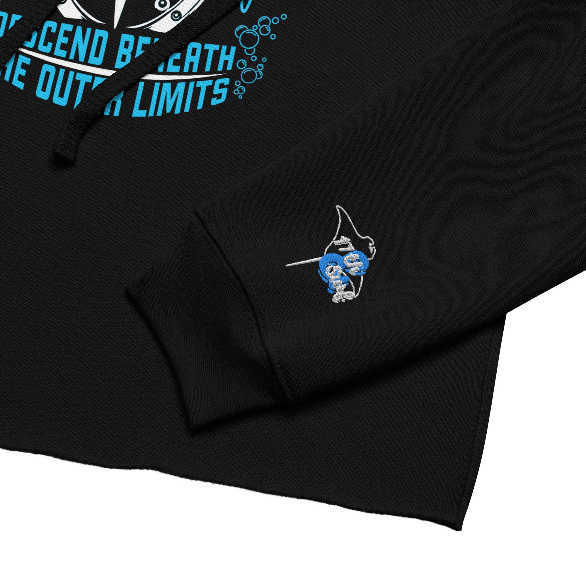 "Beneath The Outer Limits" women's cropped hoodie in black, close-up product detail of the small embroidered "17th & Surf" manta ray and surfboard logo on the cuff – "Beneath The Outer Limits" Series by 17th & Surf