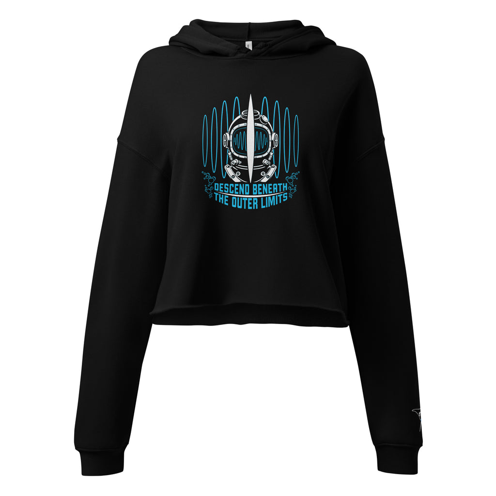 "Beneath The Outer Limits" women's cropped hoodie in black, front flat lay, featuring the large graphic of a vintage diving helmet split by a surfboard fin, framed by blue broadcast test-pattern rings with an oscillating waveform and the text "DESCEND BENEATH THE OUTER LIMITS," plus a small embroidered "17th & Surf" manta ray and surfboard logo on the cuff – "Beneath The Outer Limits" Series by 17th & Surf