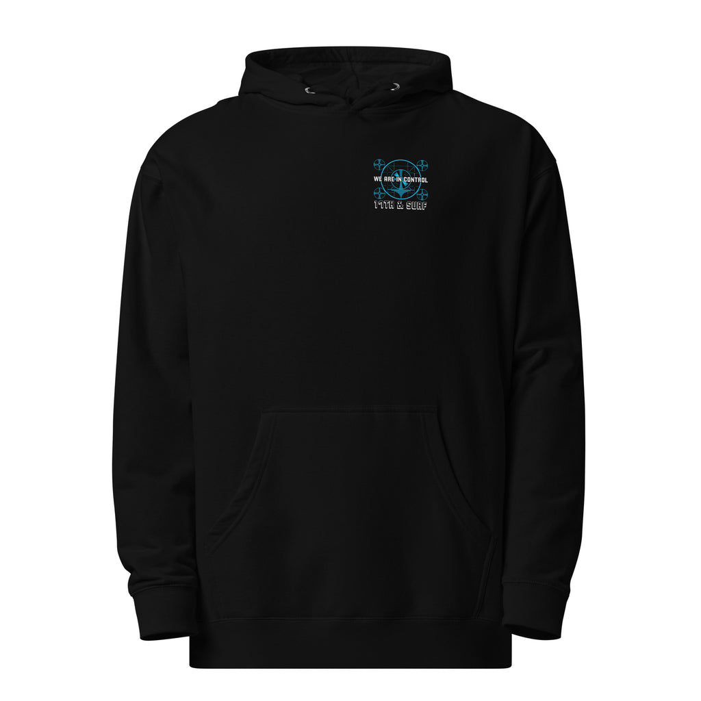 "Beneath The Outer Limits" unisex midweight hoodie in black, front flat lay, featuring the small blue "WE ARE IN CONTROL" broadcast test-pattern chest logo with "17th & Surf" text – "Beneath The Outer Limits" Series by 17th & Surf