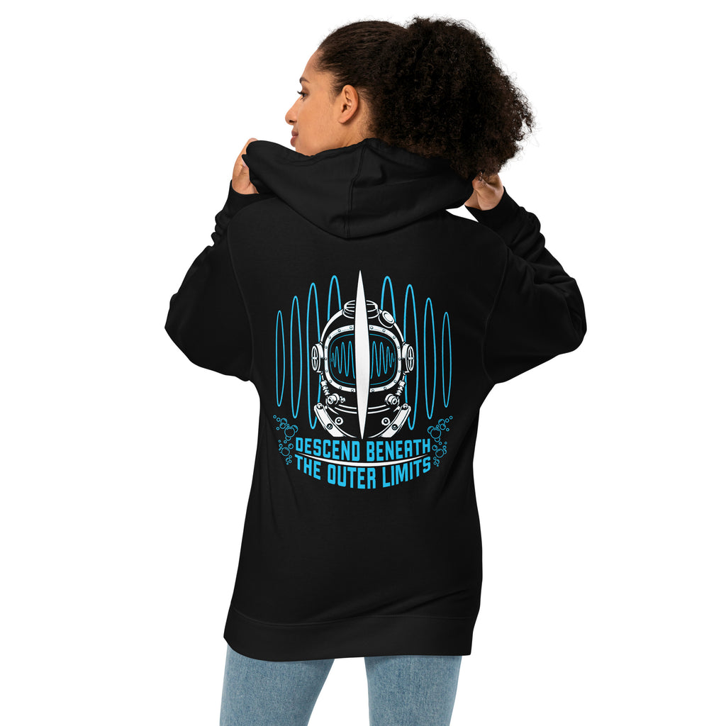 "Beneath The Outer Limits" unisex midweight hoodie in black, back view on female model, featuring the large graphic of a vintage diving helmet split by a surfboard fin, framed by blue broadcast test-pattern rings, with the text "DESCEND BENEATH THE OUTER LIMITS" – "Beneath The Outer Limits" Series by 17th & Surf