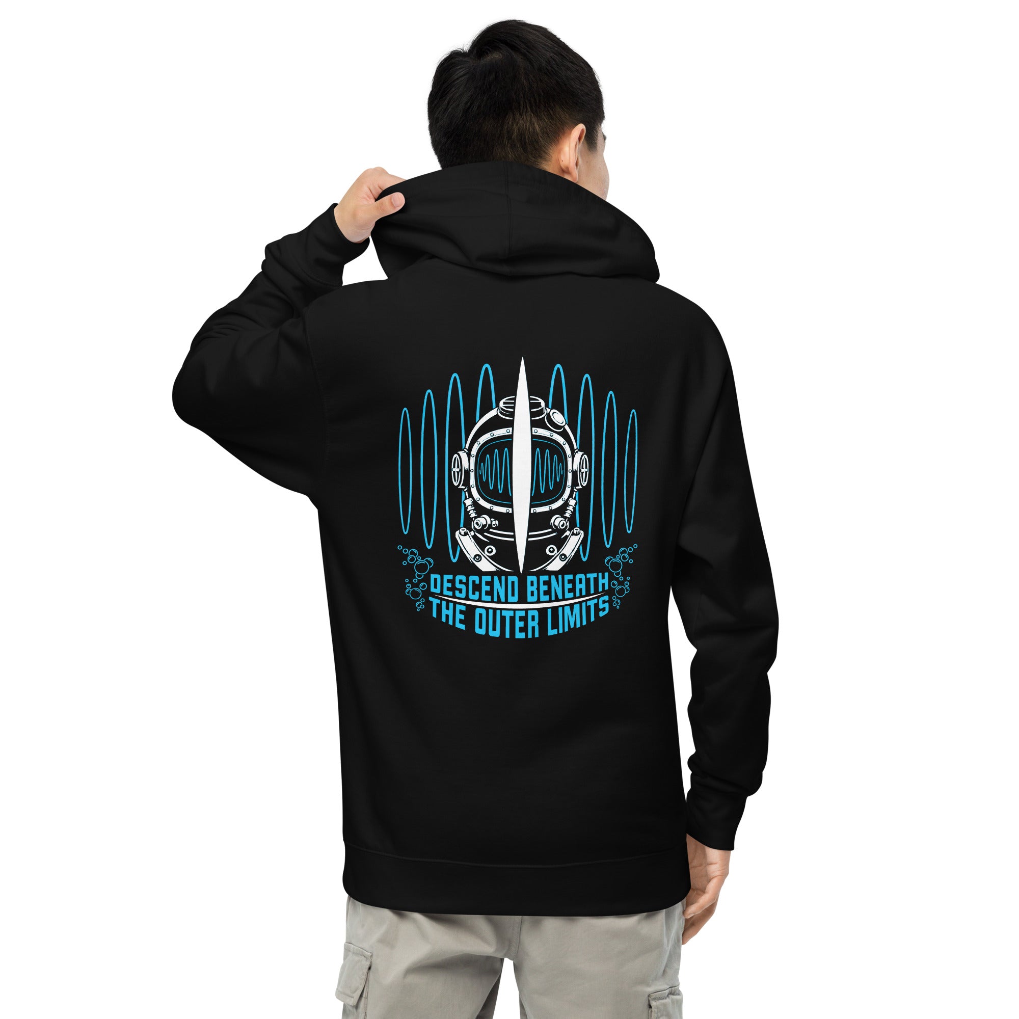 "Beneath The Outer Limits" unisex midweight hoodie in black, back view on male model, featuring the large graphic of a vintage diving helmet split by a surfboard fin, framed by blue broadcast test-pattern rings, with the text "DESCEND BENEATH THE OUTER LIMITS" – "Beneath The Outer Limits" Series by 17th & Surf