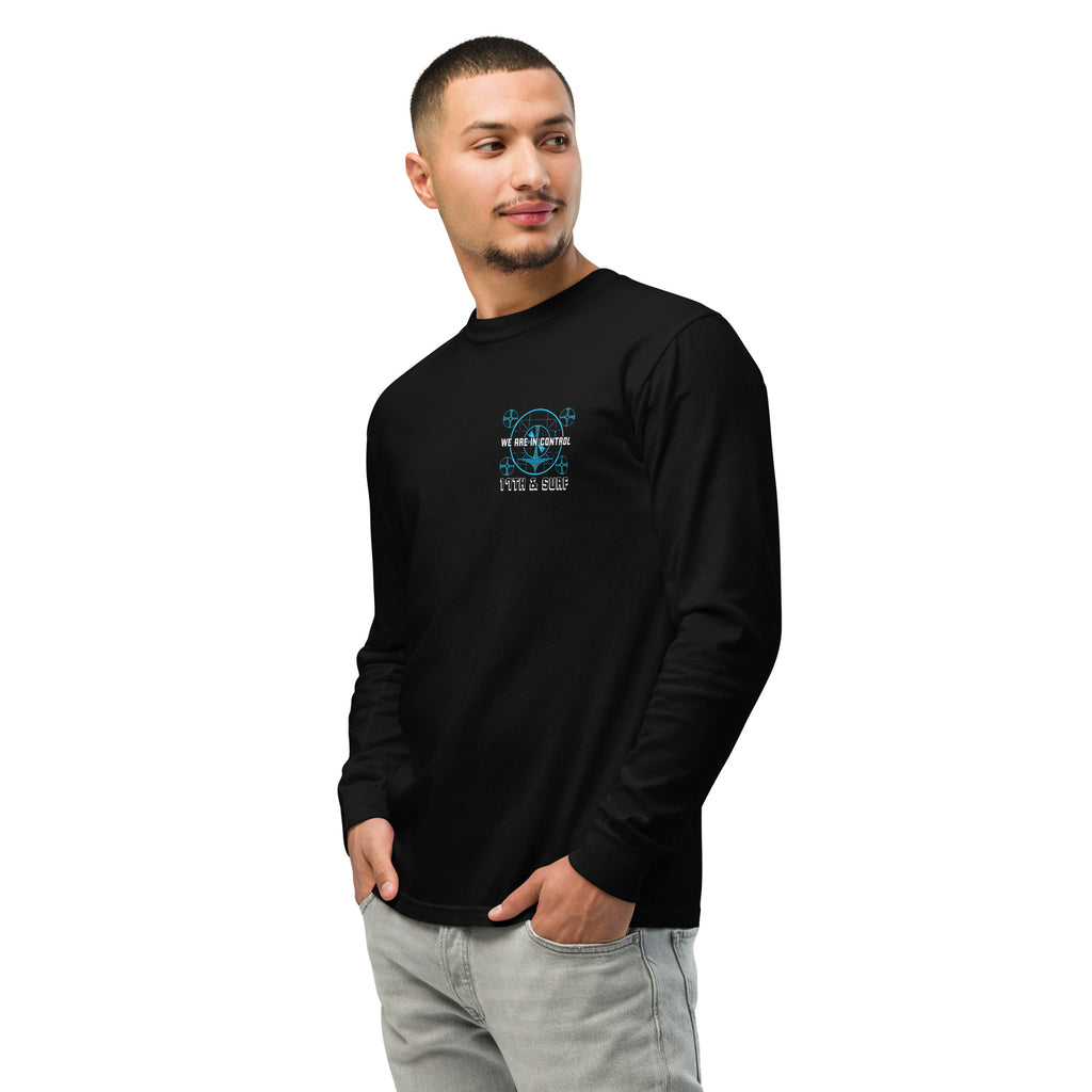 "Beneath The Outer Limits" garment-dyed heavyweight long sleeve shirt in black, side profile view on male model, featuring the small blue "WE ARE IN CONTROL" broadcast test-pattern chest logo with "17th & Surf" text – "Beneath The Outer Limits" Series by 17th & Surf