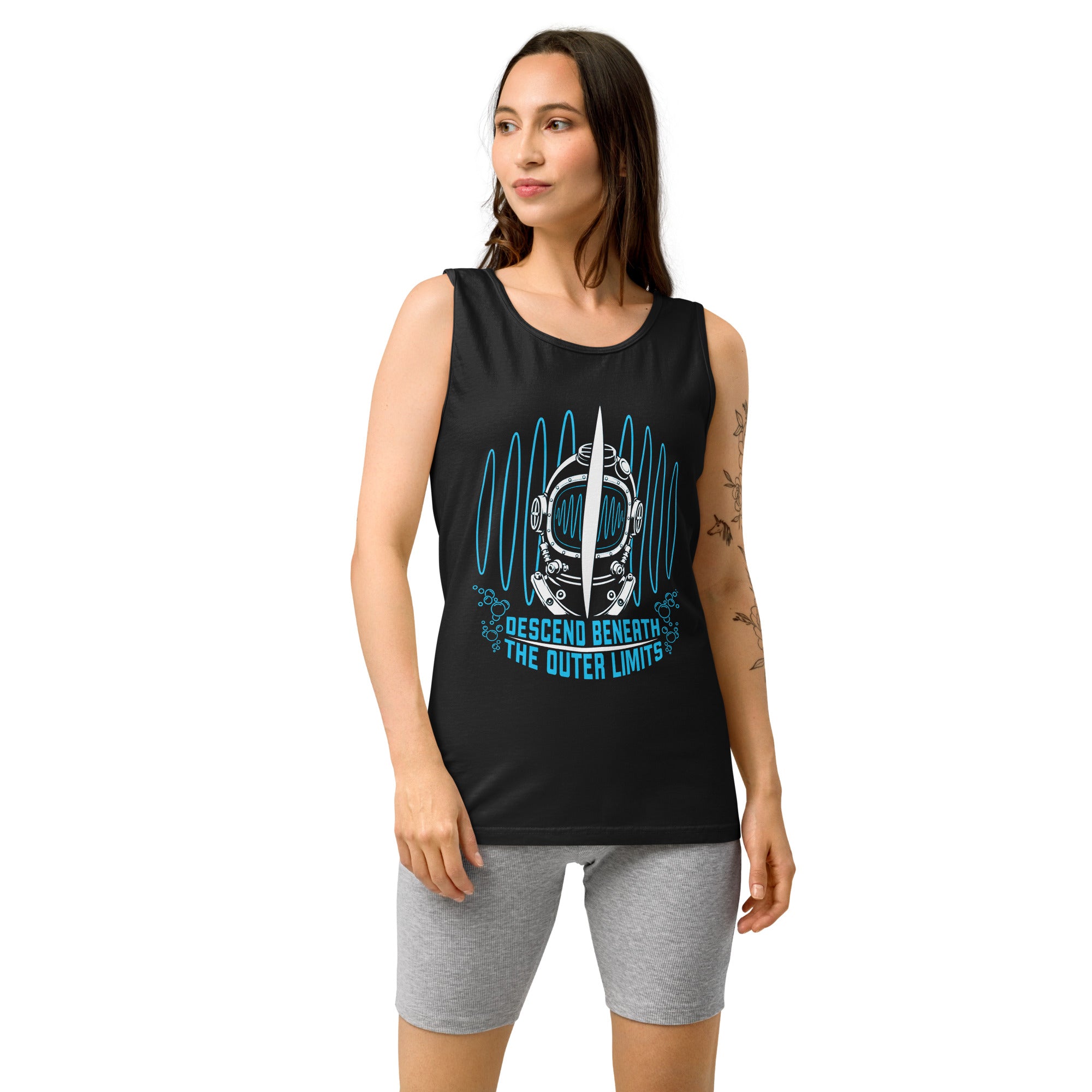 "Beneath The Outer Limits" garment-dyed tank top in black, front view on female model, featuring the large graphic of a vintage diving helmet split by a surfboard fin, framed by blue broadcast test-pattern rings, with the text "DESCEND BENEATH THE OUTER LIMITS" – "Beneath The Outer Limits" Series by 17th & Surf