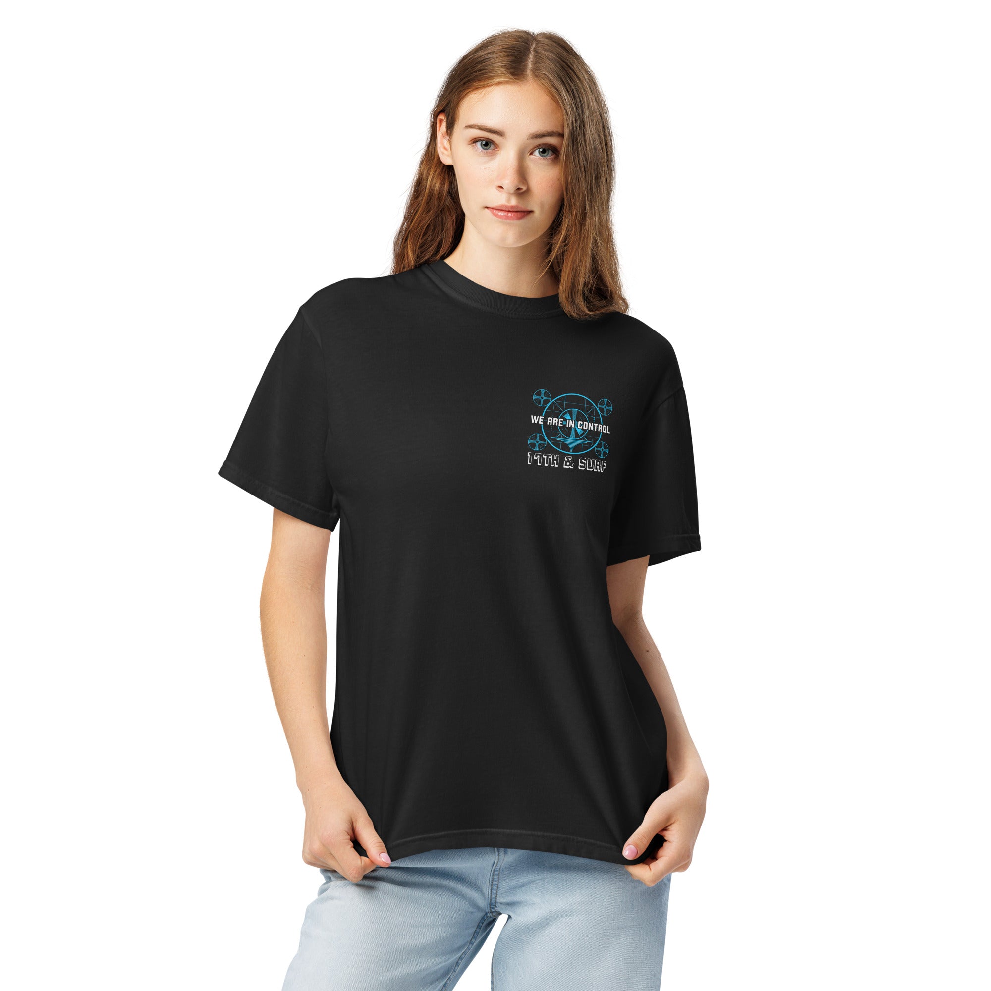 "Beneath The Outer Limits" garment-dyed heavyweight tee, front view on female model, featuring the small blue "WE ARE IN CONTROL" broadcast test-pattern chest logo with "17th & Surf" text – "Beneath The Outer Limits" Series by 17th & Surf