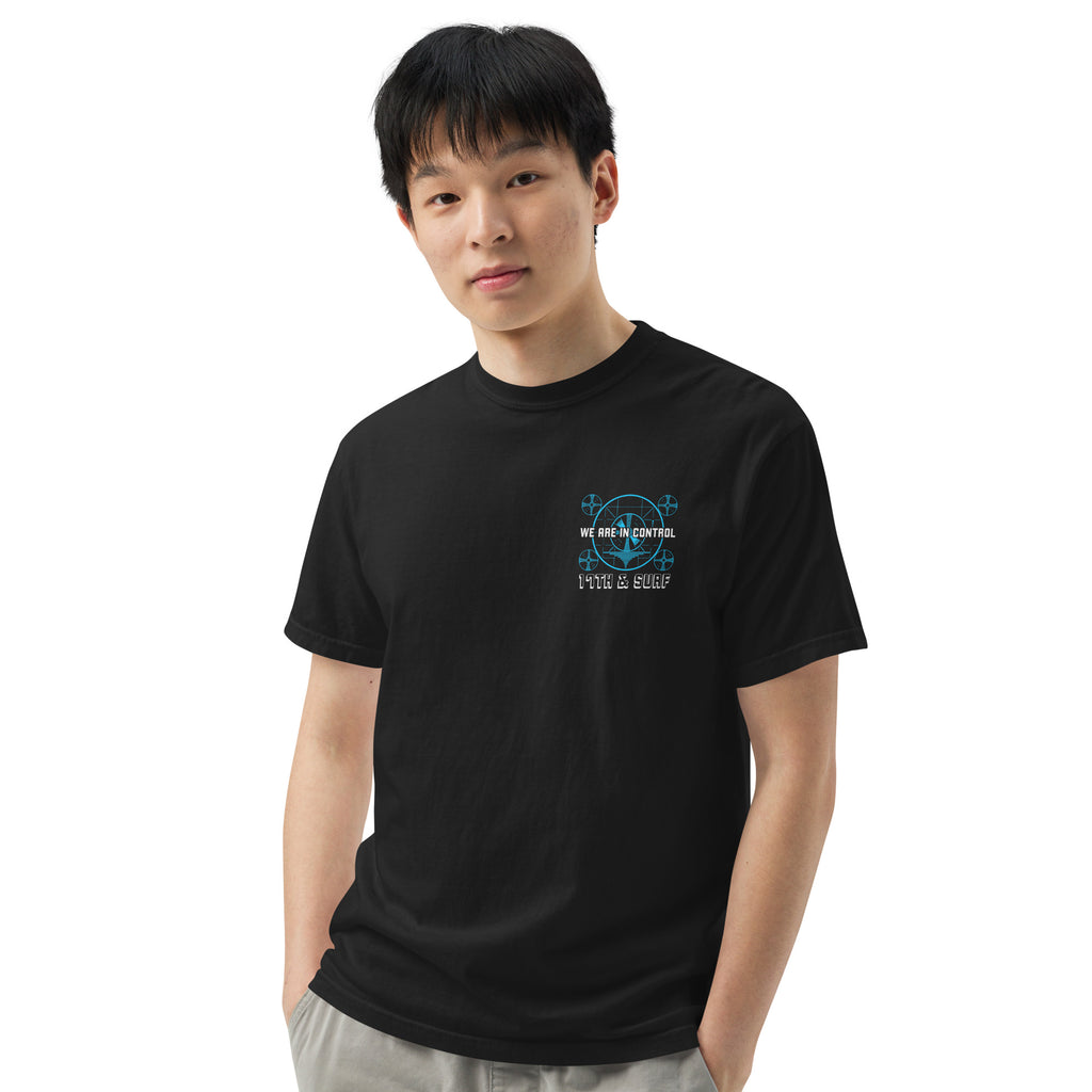 "Beneath The Outer Limits" garment-dyed heavyweight tee, front view on male model, featuring the small blue "WE ARE IN CONTROL" broadcast test-pattern chest logo with "17th & Surf" text – "Beneath The Outer Limits" Series by 17th & Surf