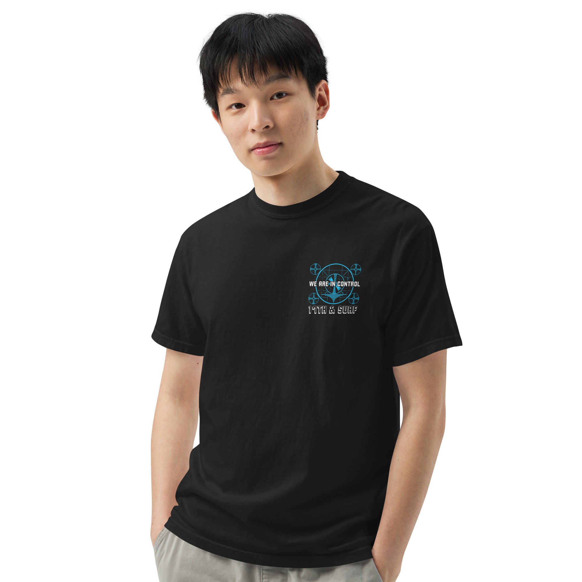 "Beneath The Outer Limits" garment-dyed heavyweight tee, front view on male model, featuring the small blue "WE ARE IN CONTROL" broadcast test-pattern chest logo with "17th & Surf" text – "Beneath The Outer Limits" Series by 17th & Surf