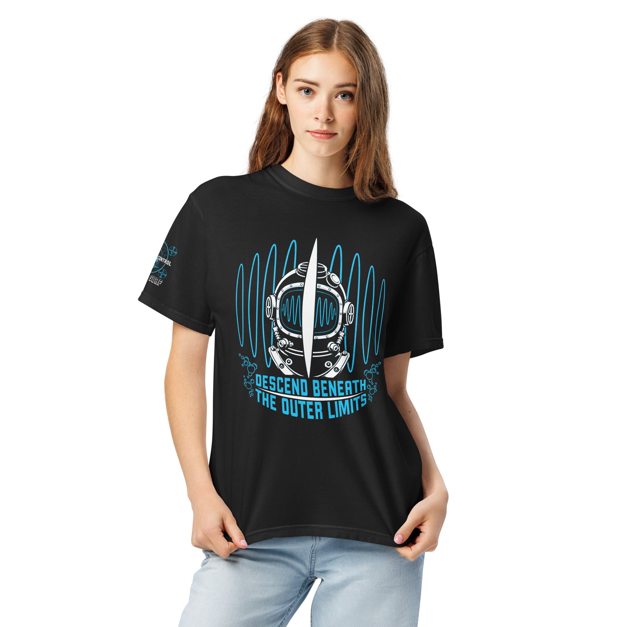 "Beneath The Outer Limits" garment-dyed heavyweight tee, front view on female model, featuring the large front-chest graphic of a vintage diving helmet split by a surfboard fin, framed by blue broadcast test-pattern rings, with the text "DESCEND BENEATH THE OUTER LIMITS" – "Beneath The Outer Limits" Series by 17th & Surf