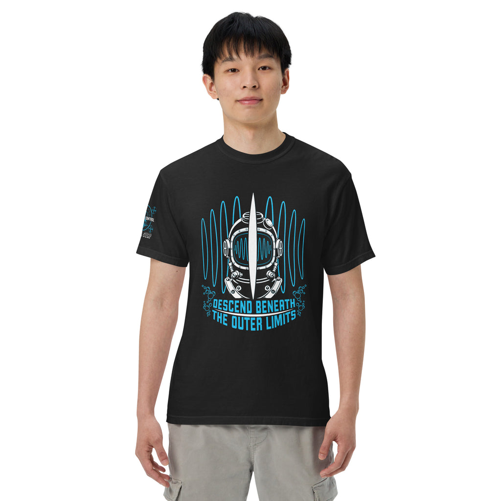 "Beneath The Outer Limits" garment-dyed heavyweight tee, front view on male model, featuring the large front-chest graphic of a vintage diving helmet split by a surfboard fin, framed by blue broadcast test-pattern rings, with the text "DESCEND BENEATH THE OUTER LIMITS" – "Beneath The Outer Limits" Series by 17th & Surf