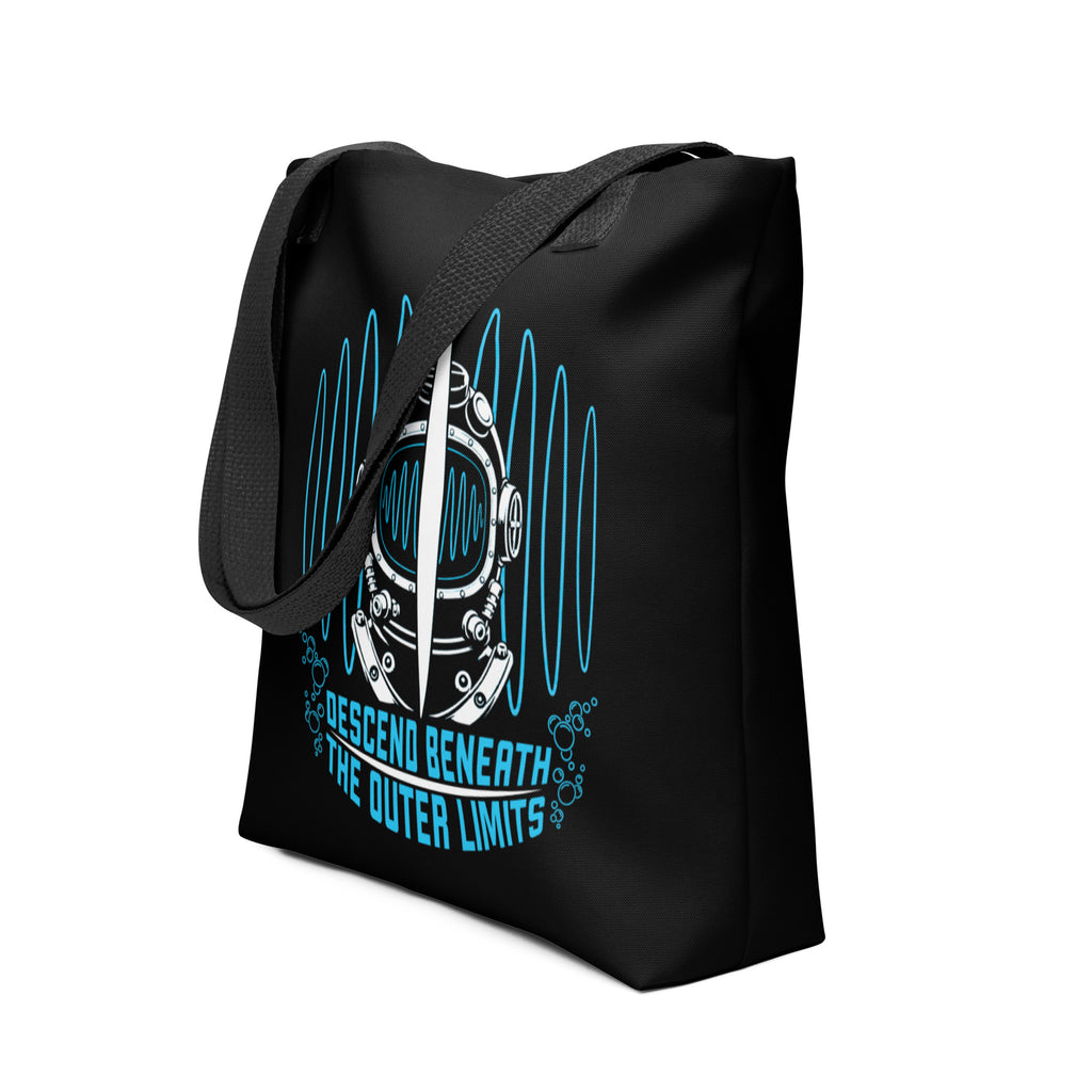 "Beneath The Outer Limits" black all-over print tote bag, side angle view, featuring the large graphic of a vintage diving helmet split by a surfboard fin, framed by blue broadcast test-pattern rings with an oscillating waveform and the text "DESCEND BENEATH THE OUTER LIMITS" – "Beneath The Outer Limits" Series by 17th & Surf