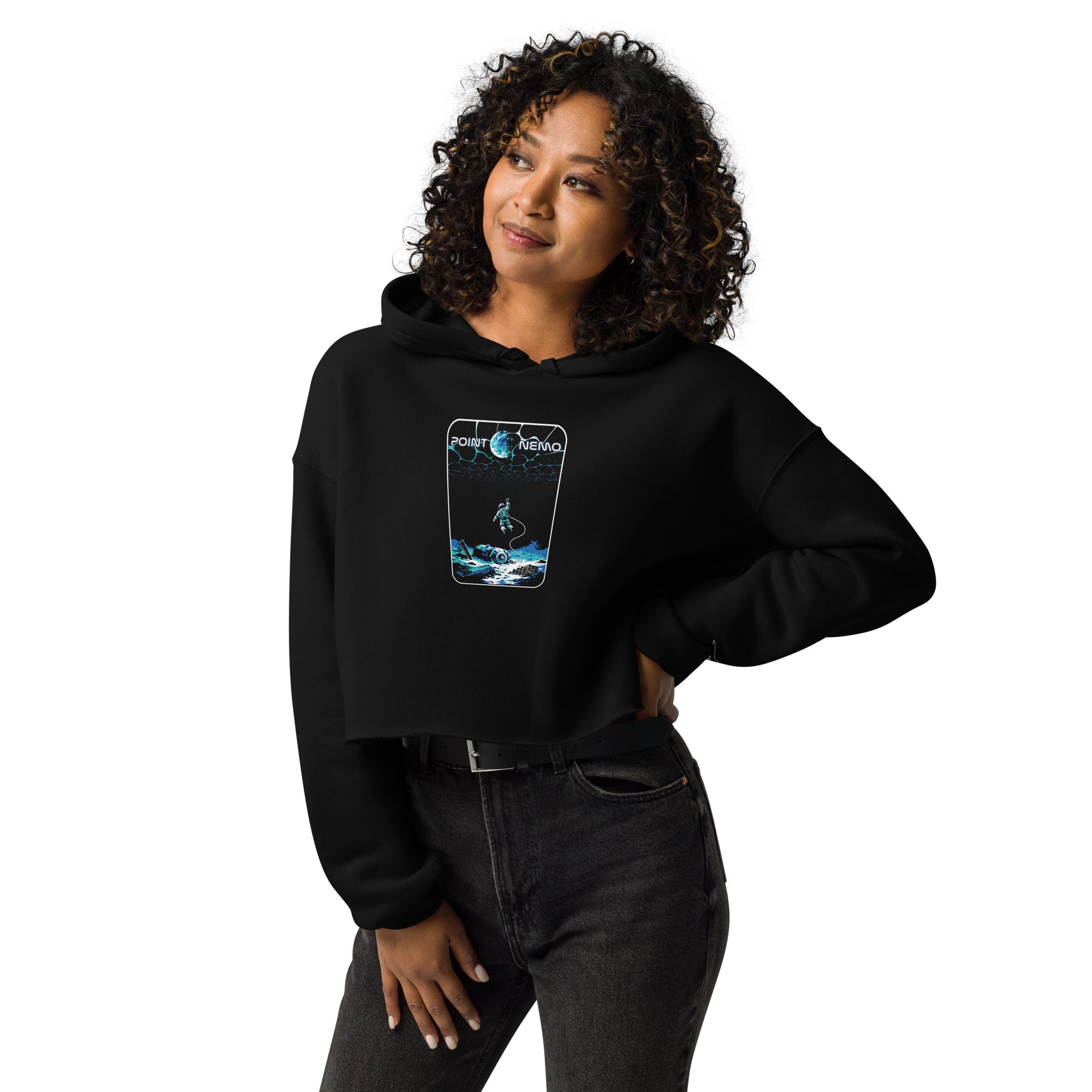 "Point Nemo" women's crop hoodie, front view on female model, featuring the large "Point Nemo" astronaut and sunken satellite wreckage graphic on the chest – "Haunted Seas" Series by 17th & Surf