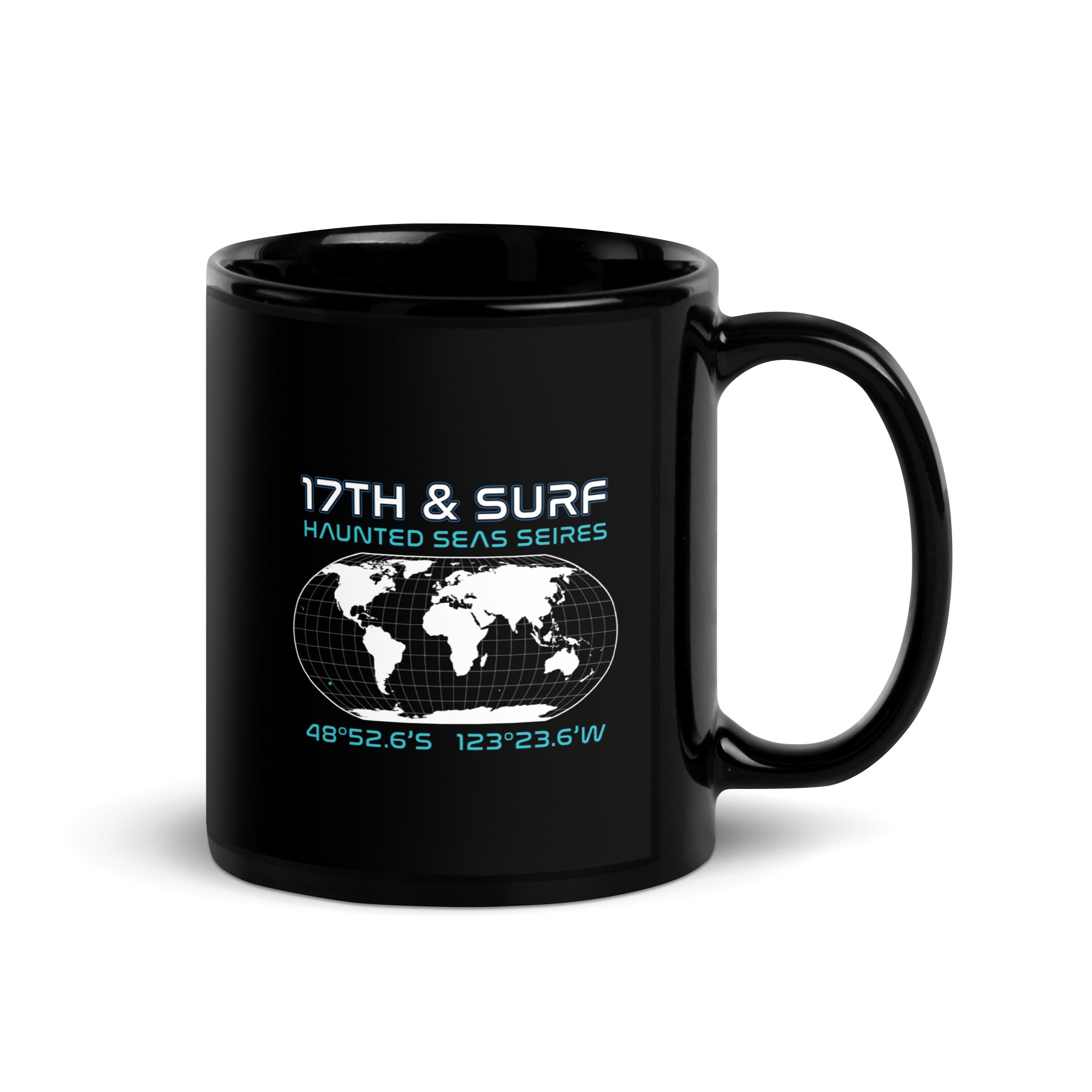 "Point Nemo" black glossy 11oz mug, handle on right, featuring the Haunted Seas Series world map patch with coordinates 48°52.6'S 123°23.6'W – "Haunted Seas" Series by 17th & Surf