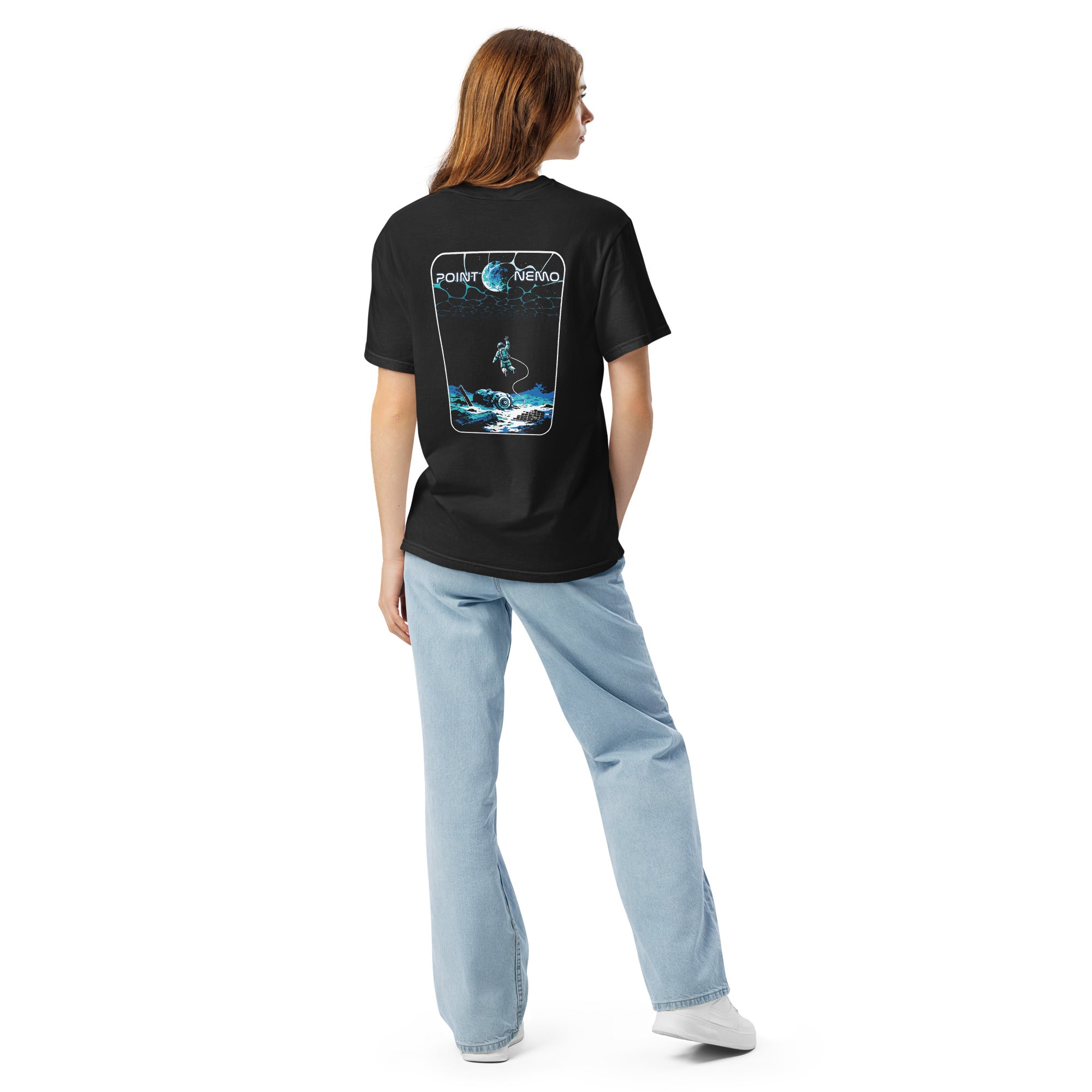 "Point Nemo" garment-dyed heavyweight tee, back view on female model, featuring the large "Point Nemo" astronaut and sunken satellite wreckage graphic across the back – "Haunted Seas" Series by 17th & Surf