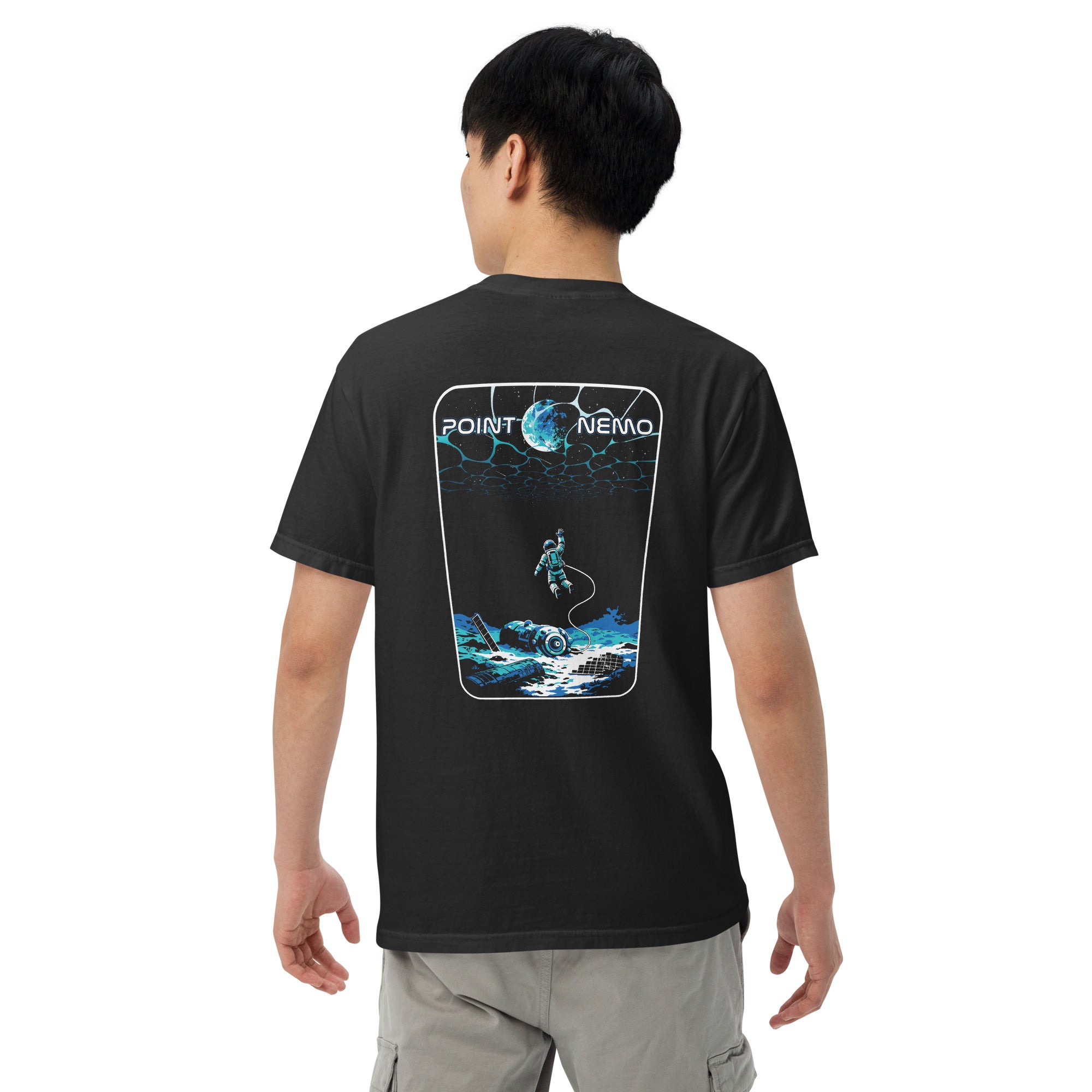 "Point Nemo" garment-dyed heavyweight tee, back view on male model, featuring the large "Point Nemo" astronaut and sunken satellite wreckage graphic across the back – "Haunted Seas" Series by 17th & Surf