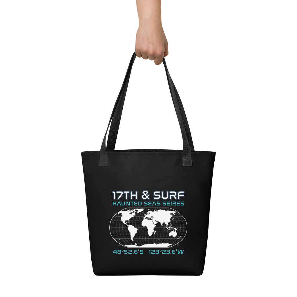 "Point Nemo" black canvas tote bag, back view, featuring the Haunted Seas Series world map patch with coordinates 48°52.6'S 123°23.6'W – "Haunted Seas" Series by 17th & Surf
