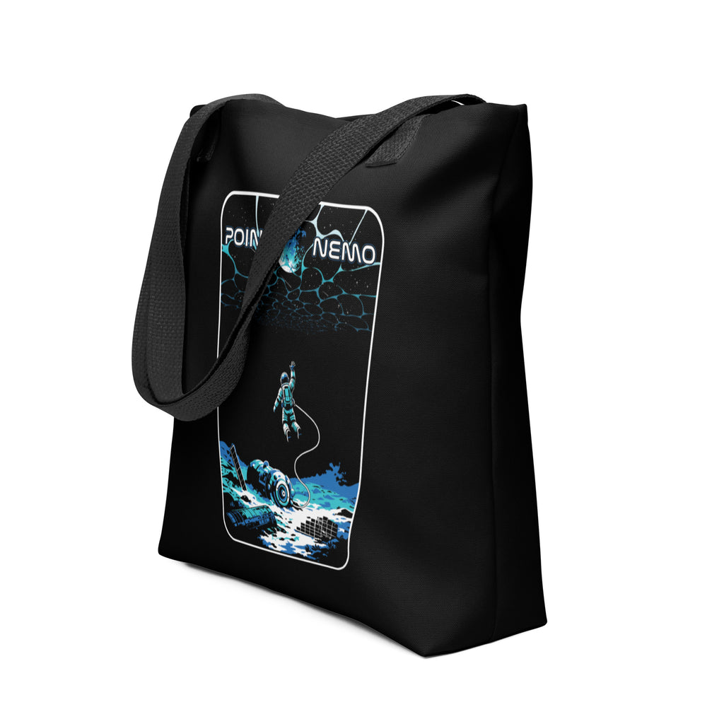 "Point Nemo" black canvas tote bag, angled front view, featuring the large "Point Nemo" astronaut and sunken satellite wreckage graphic – "Haunted Seas" Series by 17th & Surf