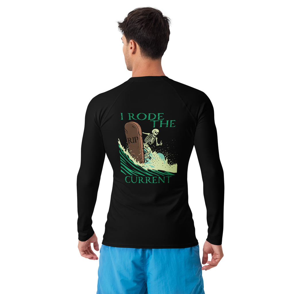 "RIP Current" black rash guard, model back angle view, featuring the skeleton surfing a "RIP" tombstone through a wave, with "I Rode the RIP Current" text graphic – 17th & Surf