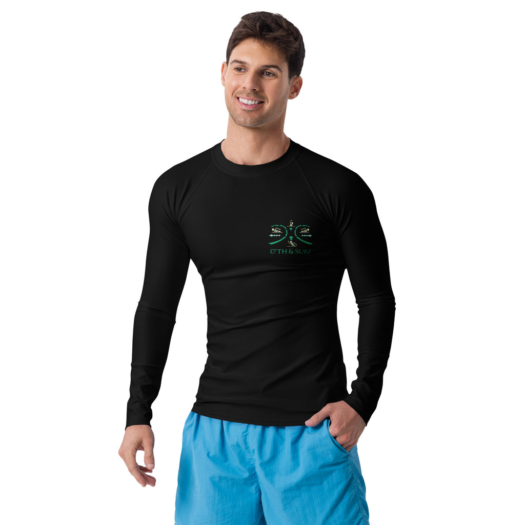 "RIP Current" black rash guard, model front angle view, featuring the small "17TH & SURF" emblem chest logo showing how to escape a real Rip Current – 17th & Surf