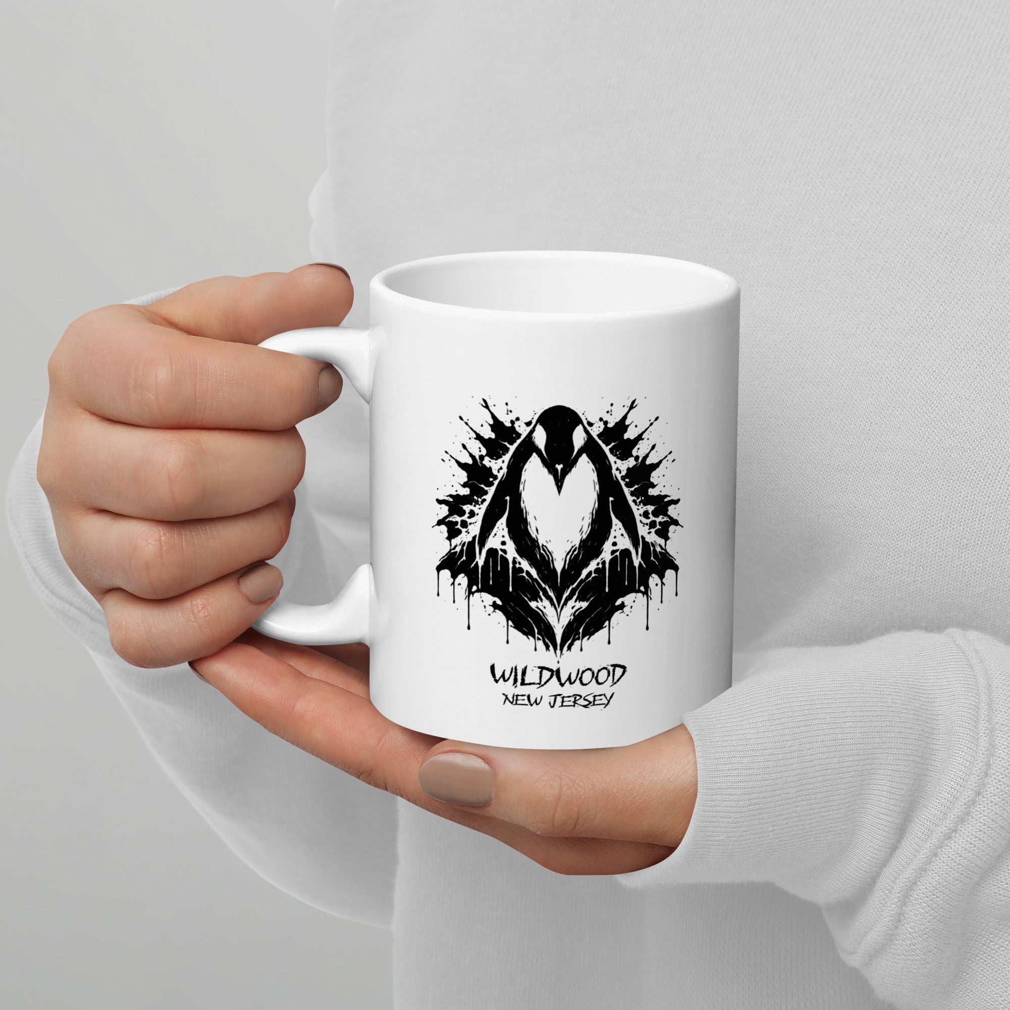 Rorschach Series Penguin 11oz ceramic mug held in hand featuring black Rorschach ink-blot penguin design with "Wildwood New Jersey" text – 17th & Surf