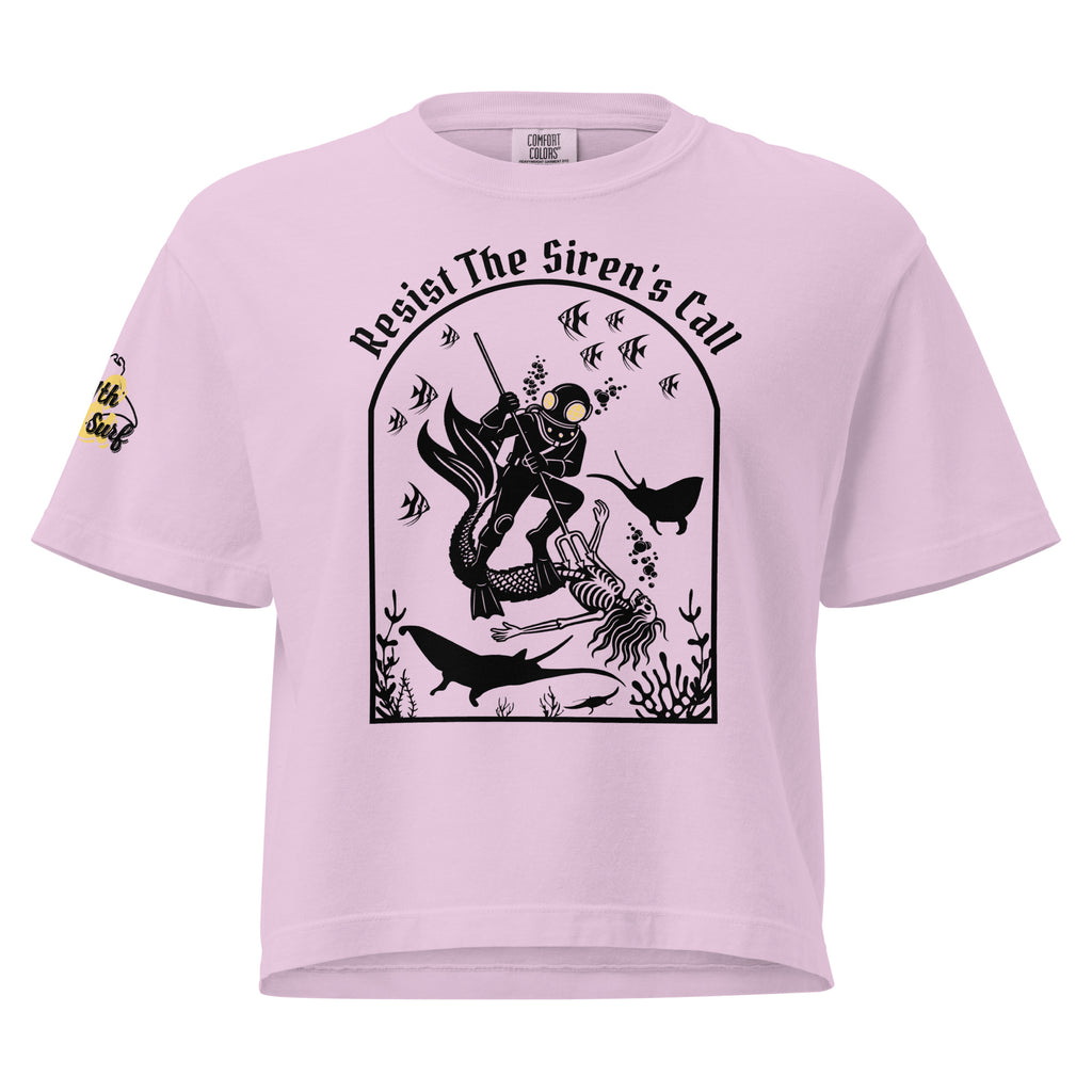"Resist The Siren's Call" women's heavyweight boxy t-shirt front view in orchid pink featuring black-print arched graphic of a deep-sea diver spearing a mermaid skeleton surrounded by tropical fish and manta rays – 17th & Surf