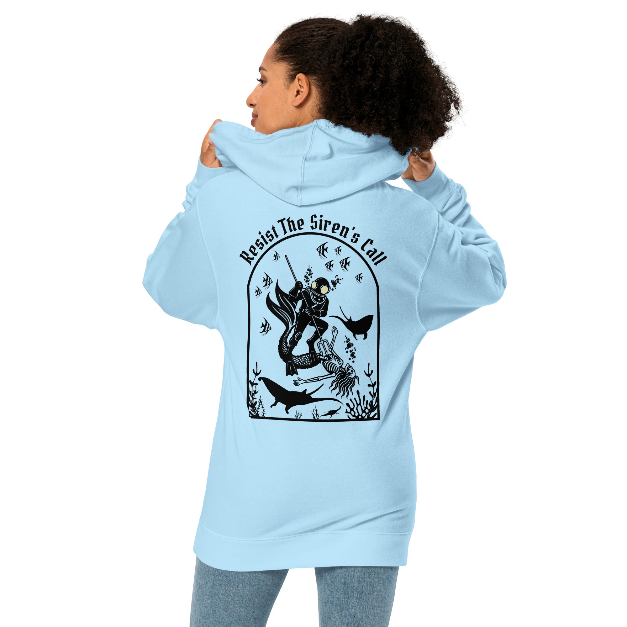Model wearing "Resist The Siren's Call" garment-dyed heavyweight hoodie in light blue, back angle view featuring black arched graphic of a deep-sea diver spearing a mermaid skeleton surrounded by fish and manta rays – 17th & Surf