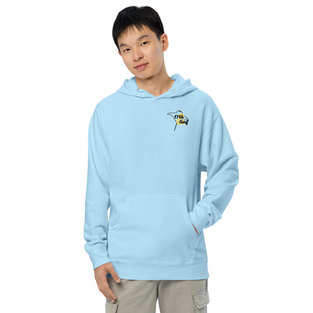 Model wearing "Resist The Siren's Call" garment-dyed heavyweight hoodie in light blue with black and yellow "17th & Surf" manta ray chest logo, front view – 17th & Surf