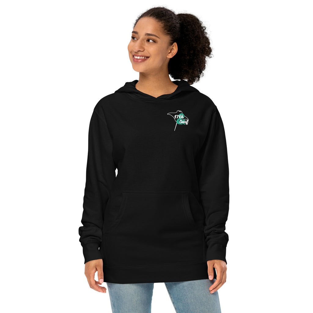 Model wearing "Resist The Siren's Call" garment-dyed heavyweight hoodie in black with white and teal "17th & Surf" manta ray chest logo, front angle view – 17th & Surf