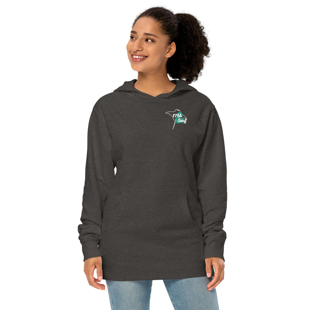 Model wearing "Resist The Siren's Call" garment-dyed heavyweight hoodie in charcoal heather with white and teal "17th & Surf" manta ray chest logo, front angle view – 17th & Surf