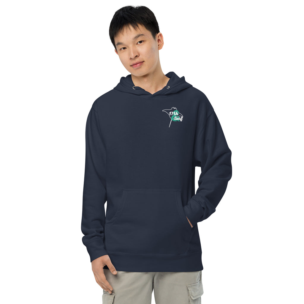 Model wearing "Resist The Siren's Call" garment-dyed heavyweight hoodie in classic navy with white and teal "17th & Surf" manta ray chest logo, front view – 17th & Surf