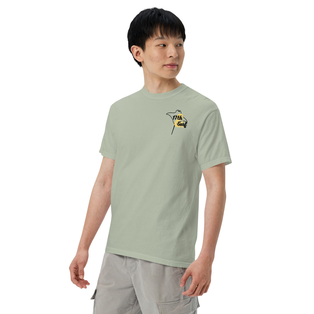 Model wearing "Resist The Siren's Call" black print garment-dyed heavyweight t-shirt in sage bay green with black and yellow "17th & Surf" manta ray chest logo – 17th & Surf
