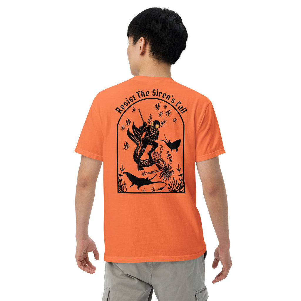 Model wearing "Resist The Siren's Call" black print garment-dyed heavyweight t-shirt in burnt orange, back view featuring black arched graphic of a deep-sea diver spearing a mermaid skeleton surrounded by fish and manta rays – 17th & Surf