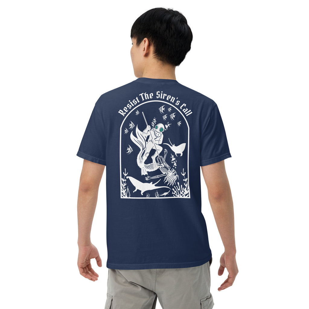 Model wearing "Resist The Siren's Call" white print garment-dyed heavyweight t-shirt in true navy, back view featuring white arched graphic of a deep-sea diver spearing a mermaid skeleton surrounded by fish and manta rays – 17th & Surf
