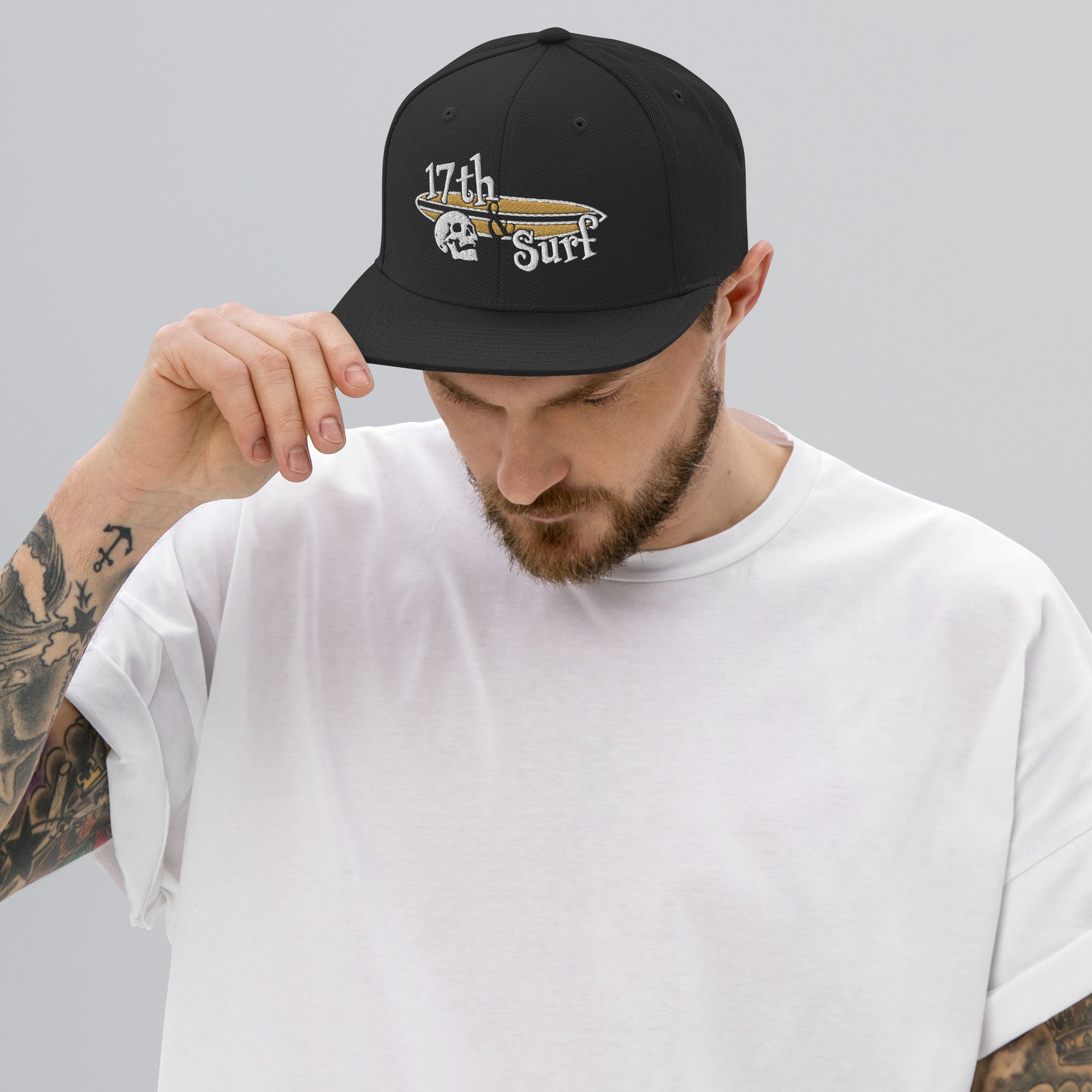 "Forever Waiting For The Next Wave" Black snapback hat, third front view, embroidered with the skull and surfboard logo from the meditating skeleton surfer design – Forever Waiting For The Next Wave Collection by 17th & Surf