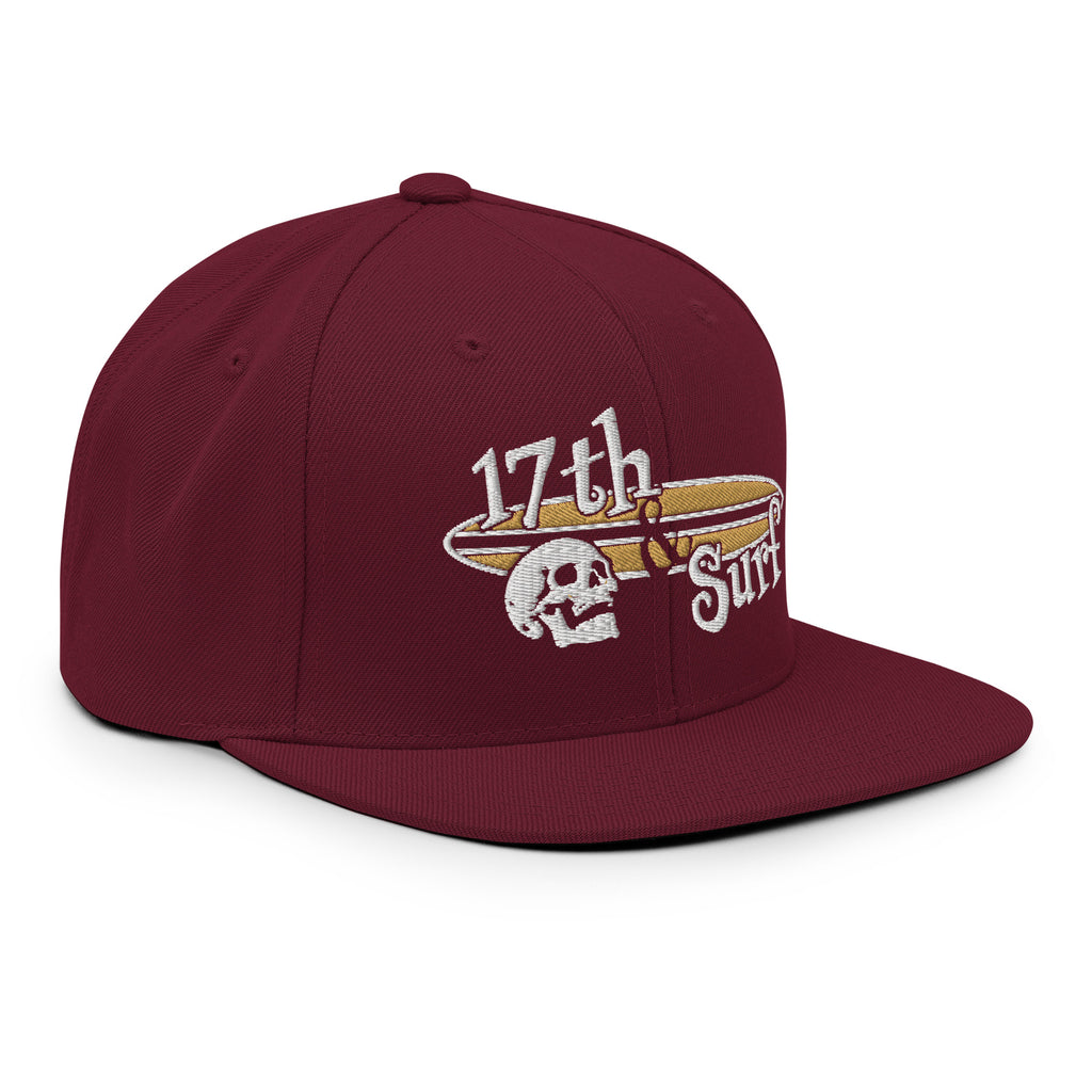 "Forever Waiting For The Next Wave" Maroon snapback hat, right-front angled view, embroidered with the skull and surfboard logo from the meditating skeleton surfer design – Forever Waiting For The Next Wave Collection by 17th & Surf