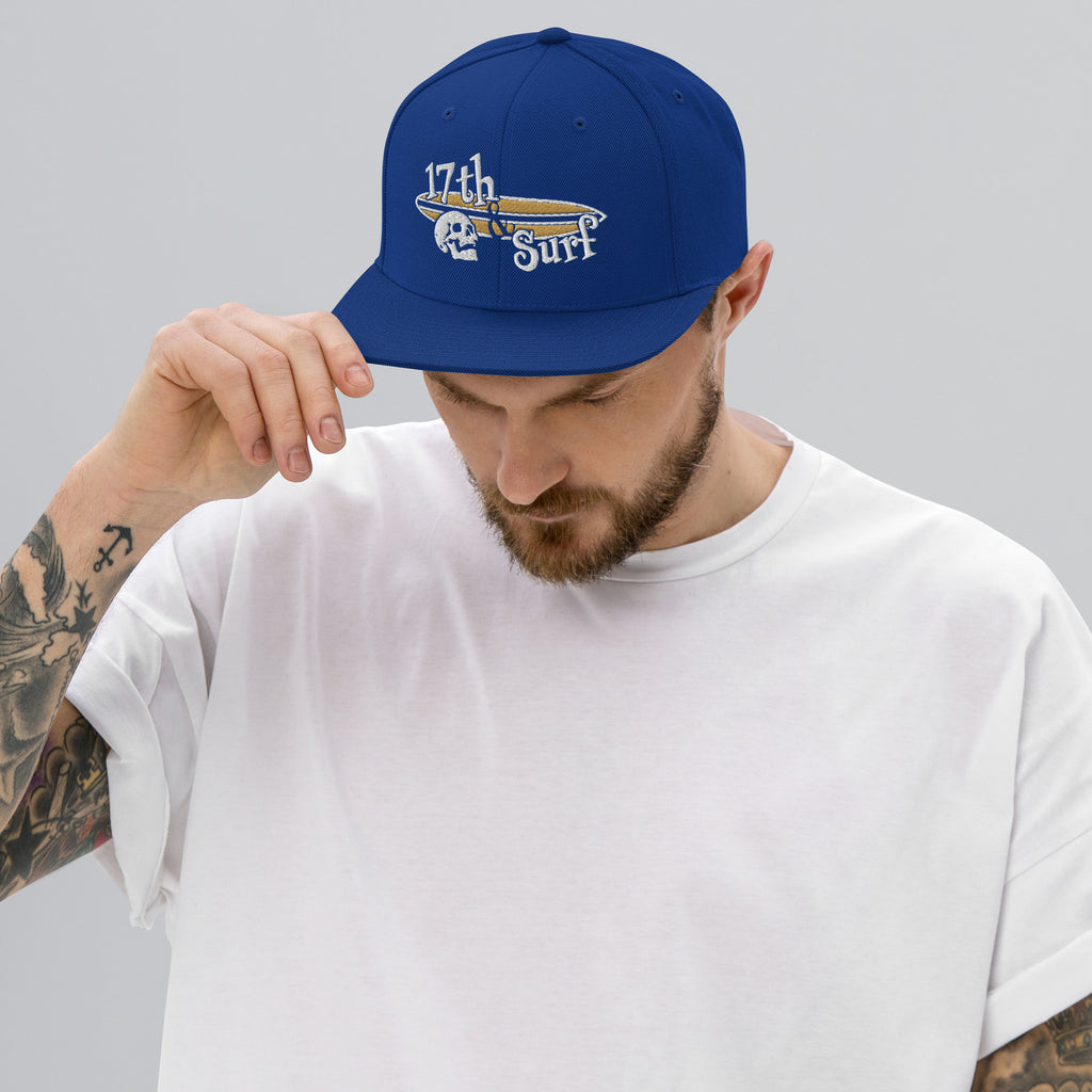 "Forever Waiting For The Next Wave" Royal Blue snapback hat, third front view, embroidered with the skull and surfboard logo from the meditating skeleton surfer design – Forever Waiting For The Next Wave Collection by 17th & Surf